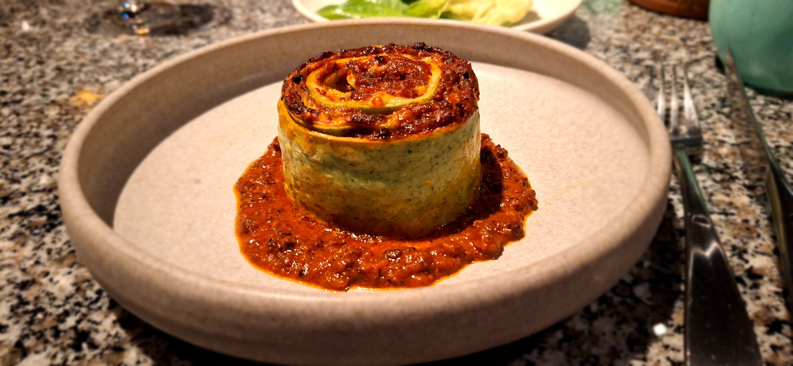 a plate of food on a marble surface