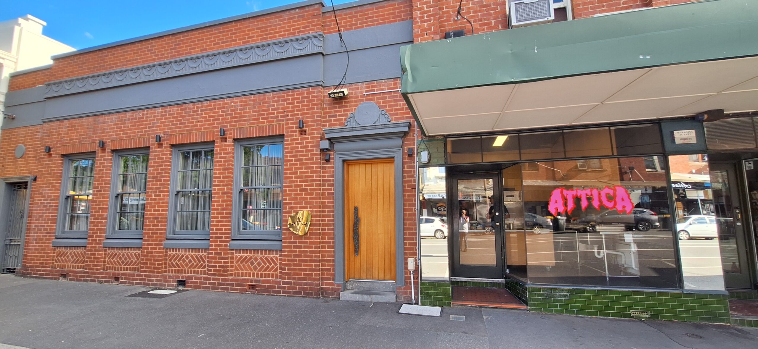 a brick building with a door and windows