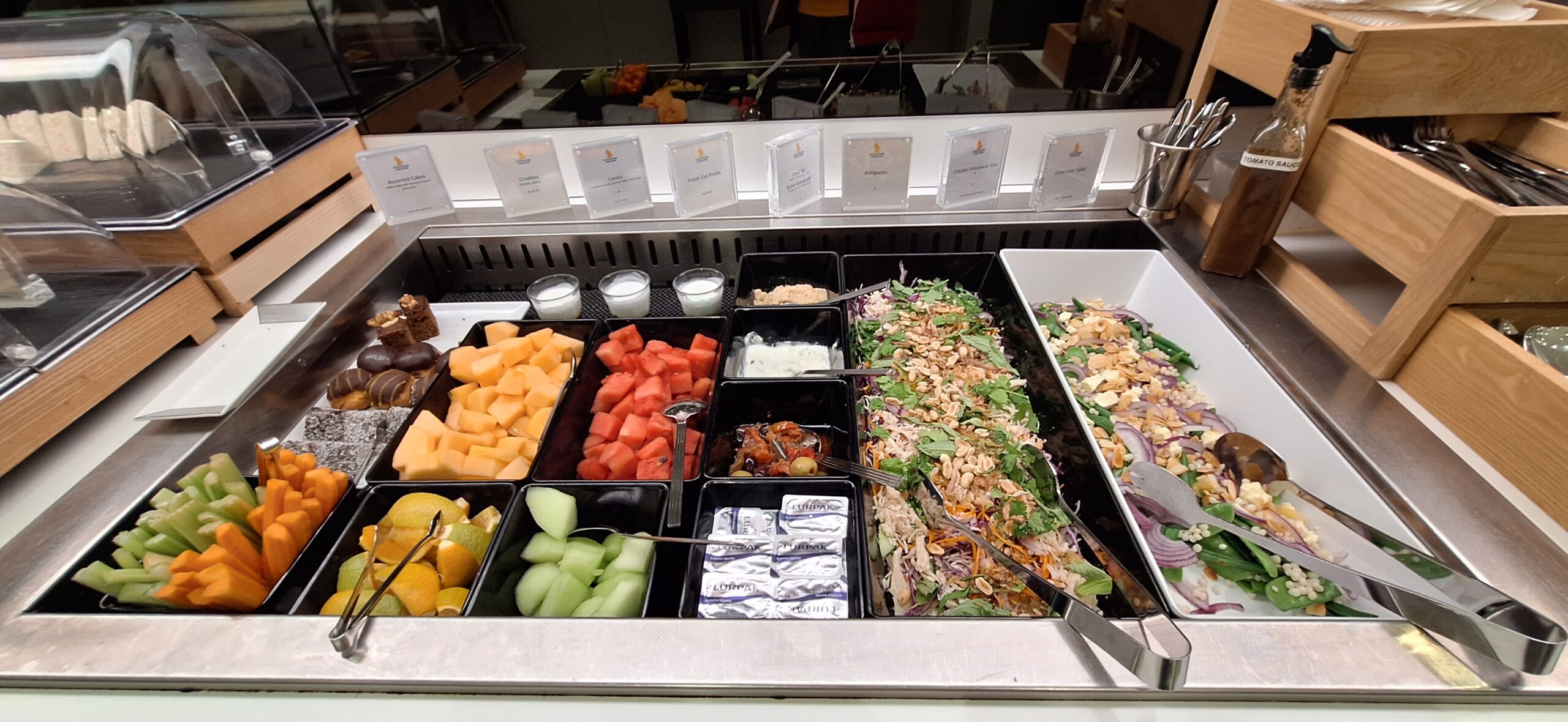 a buffet with different foods in containers