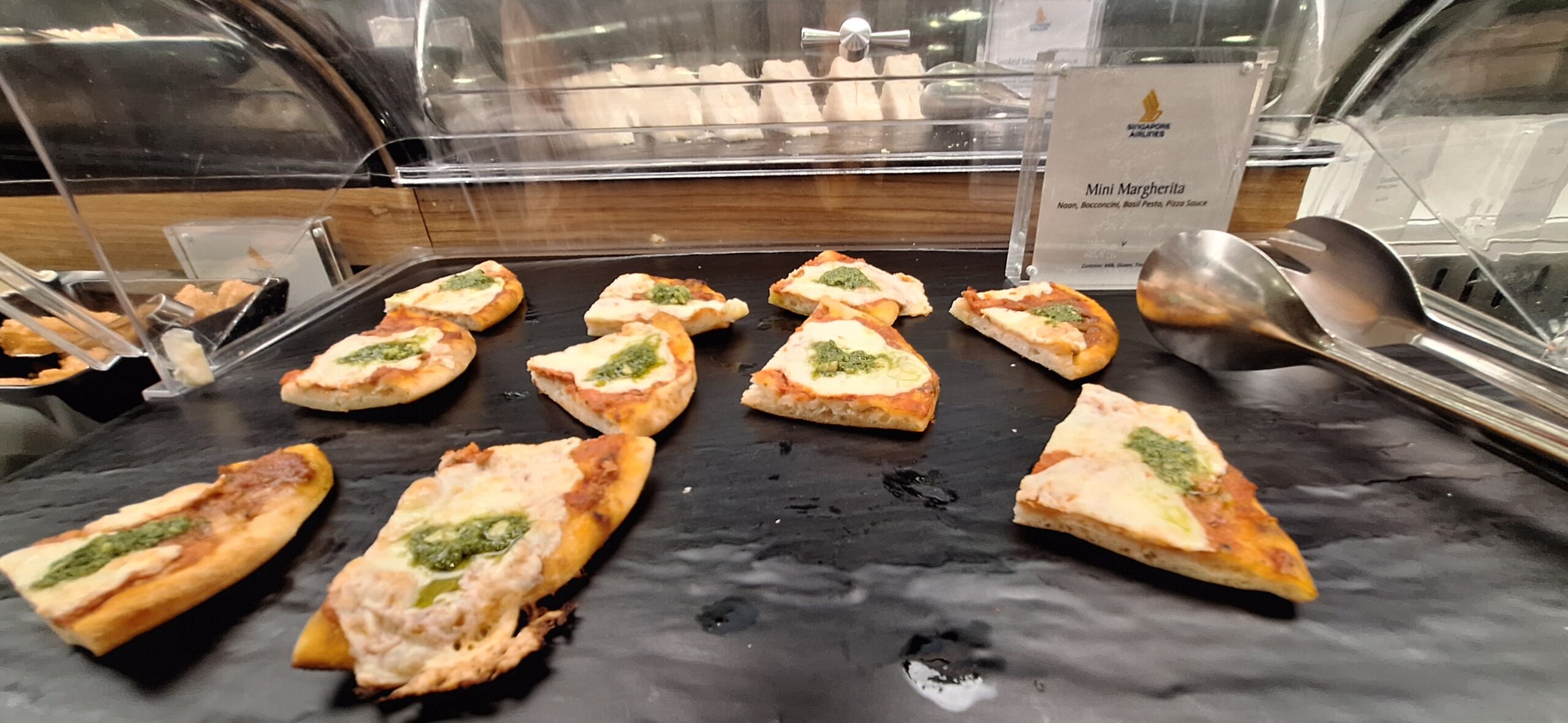 a small pizzas on a black surface