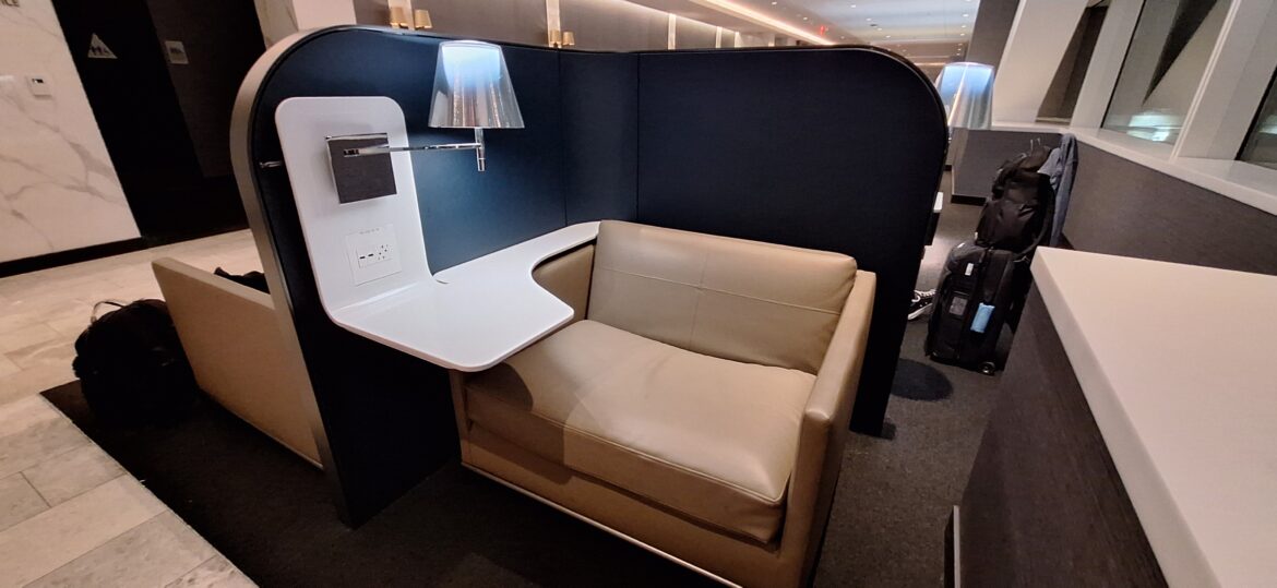 United Polaris Lounge – Seating (1) a couch in a room