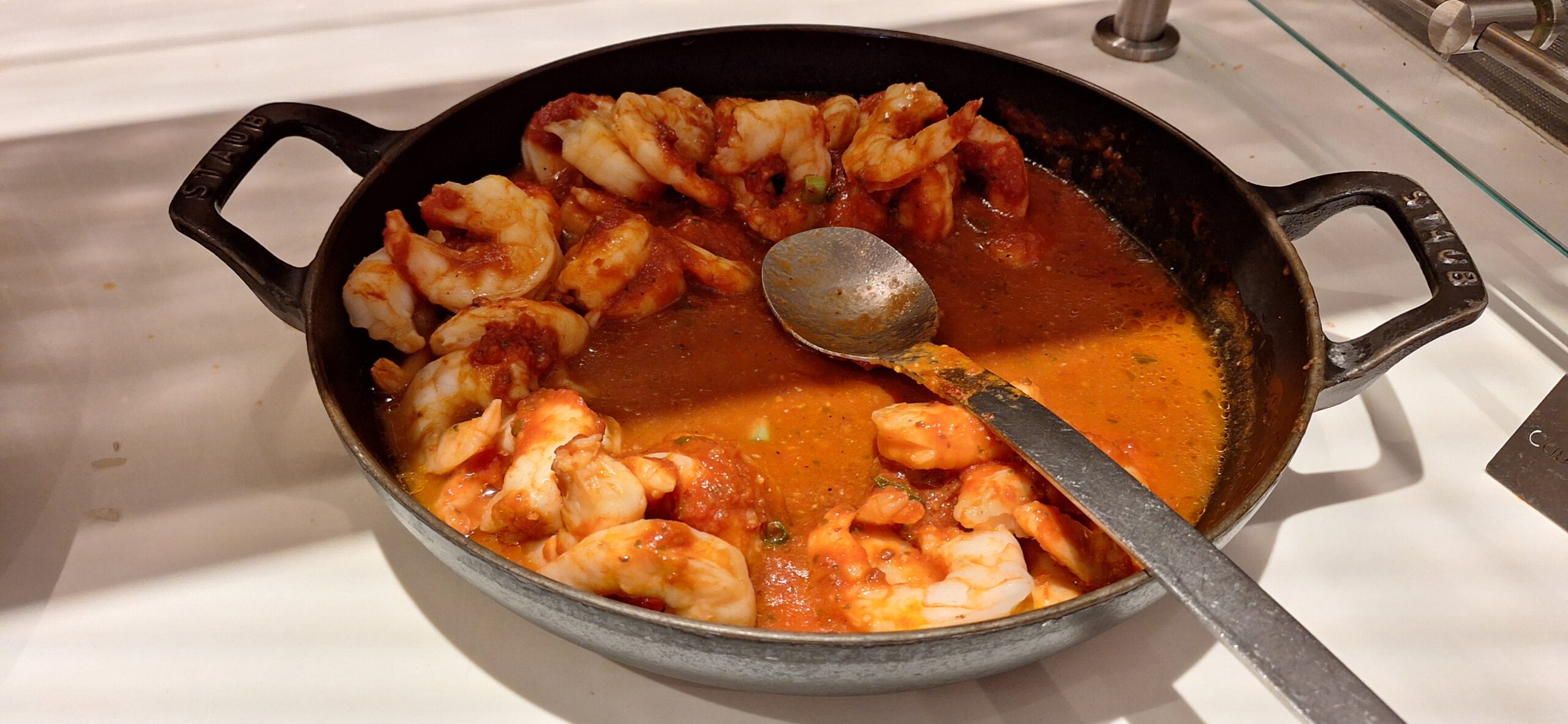 a pan of shrimp and sauce