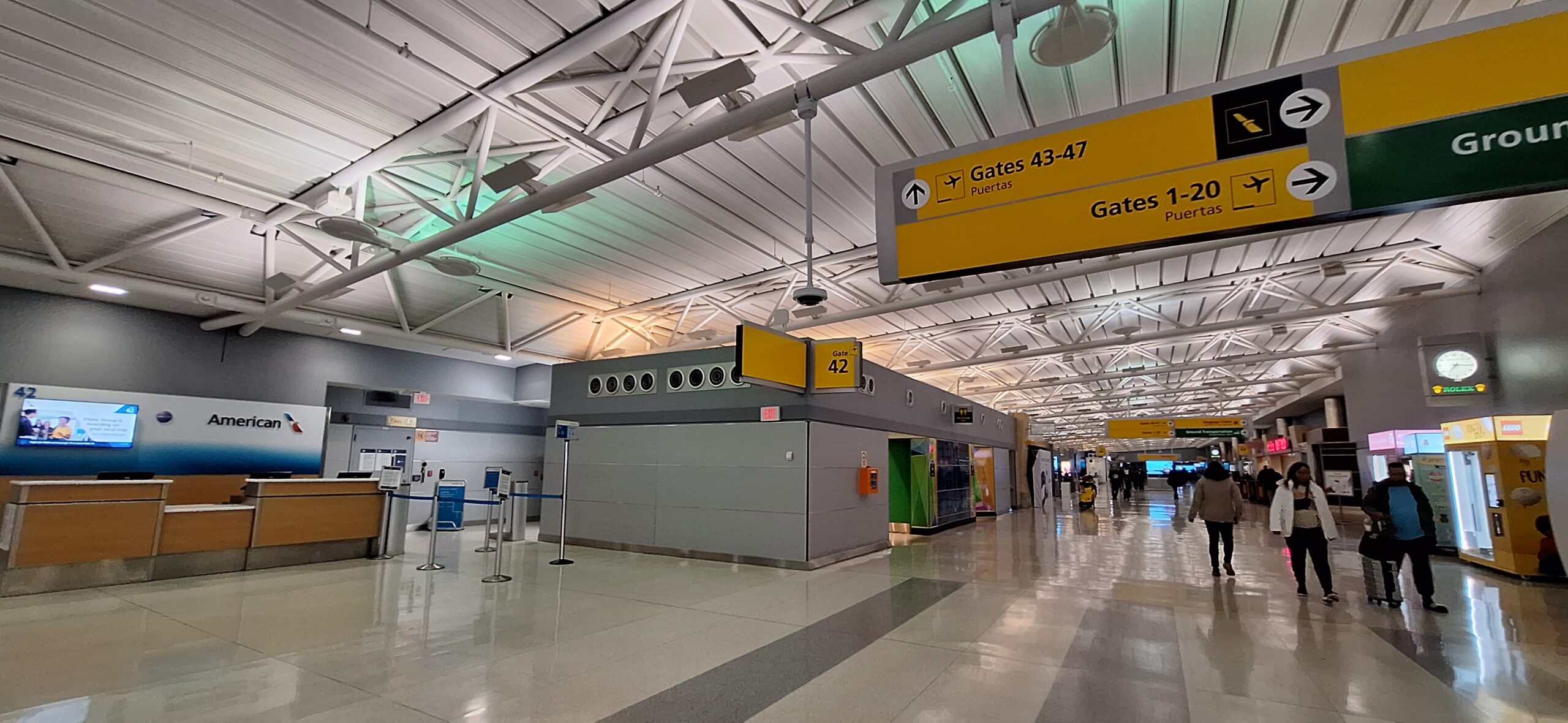 a group of people walking in an airport