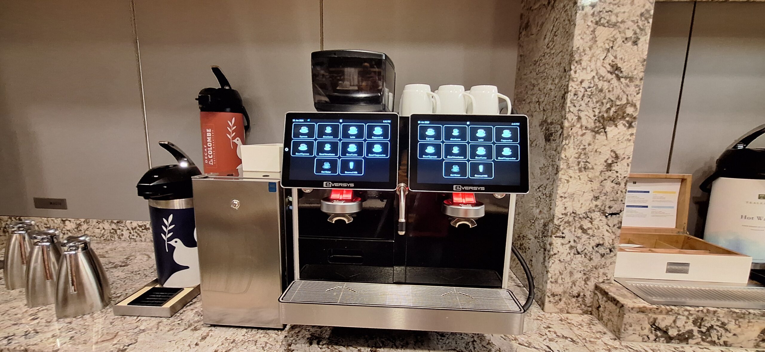 a machine with screens and cups on it