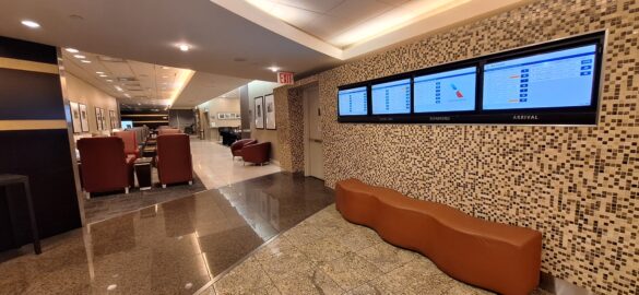 a lobby with a television and a wall