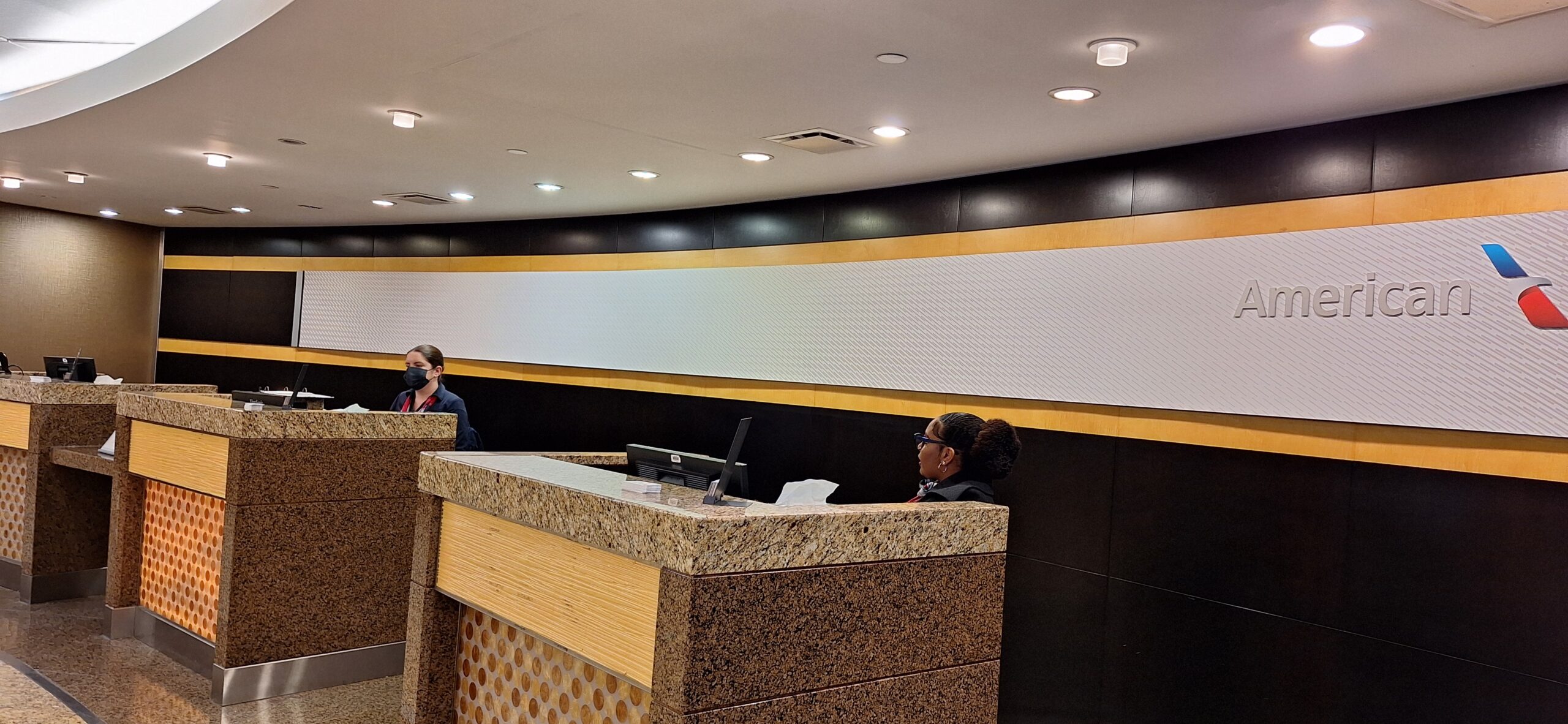 people sitting at a reception desk