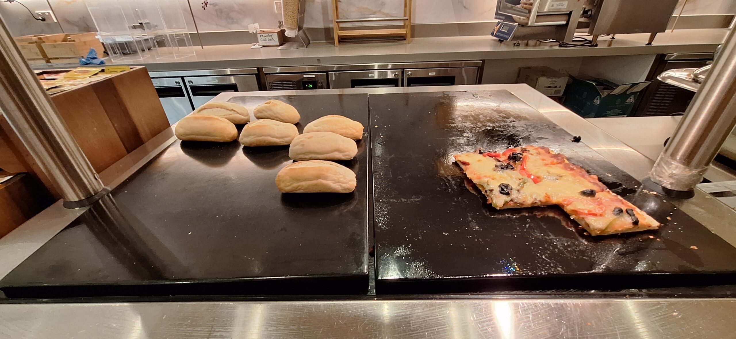 a pizza and bread on a counter