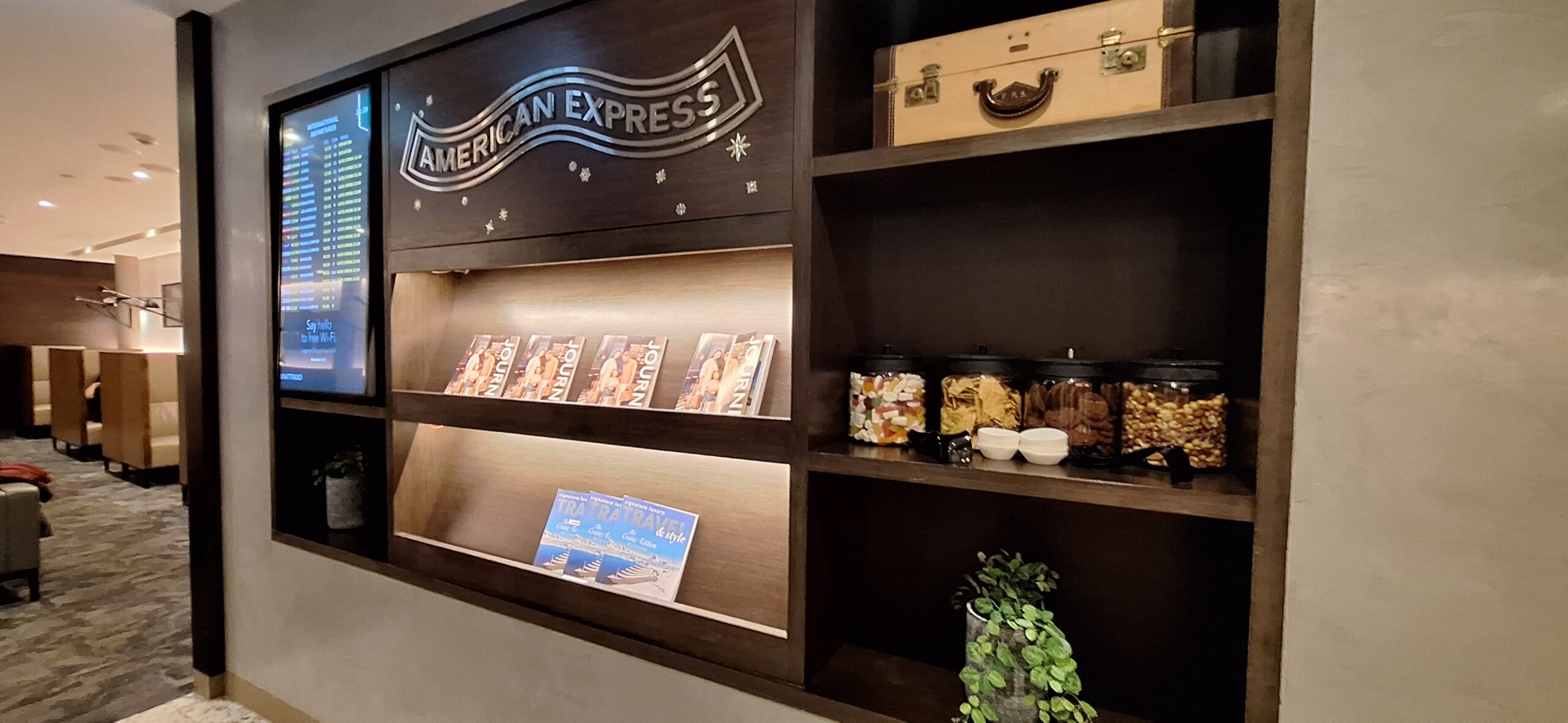 a shelf with food and a suitcase on it