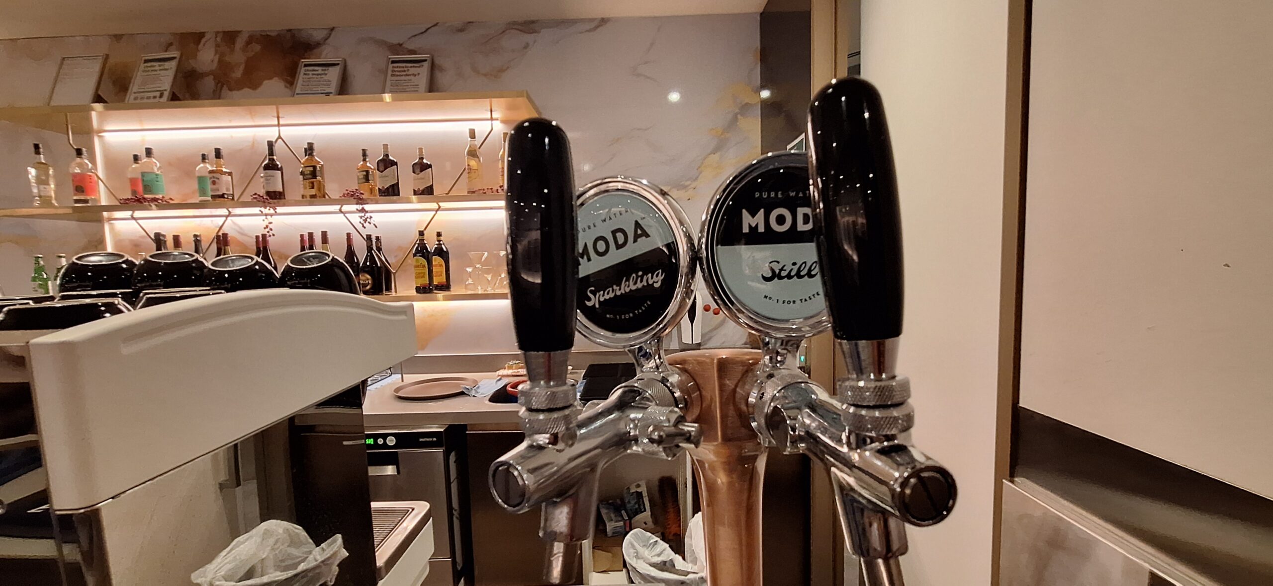 a group of beer taps in a bar