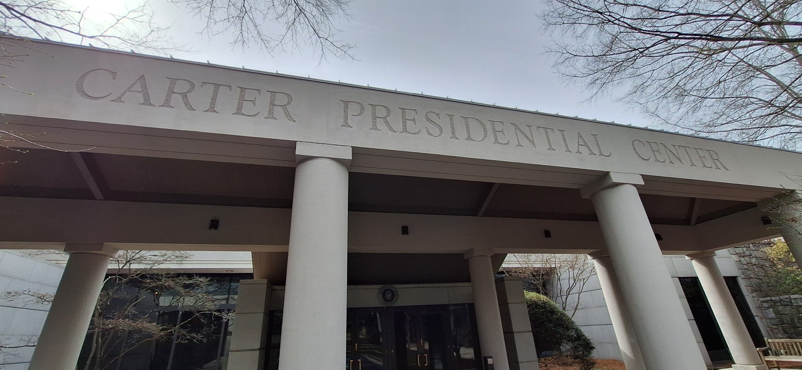 a building with columns and a sign