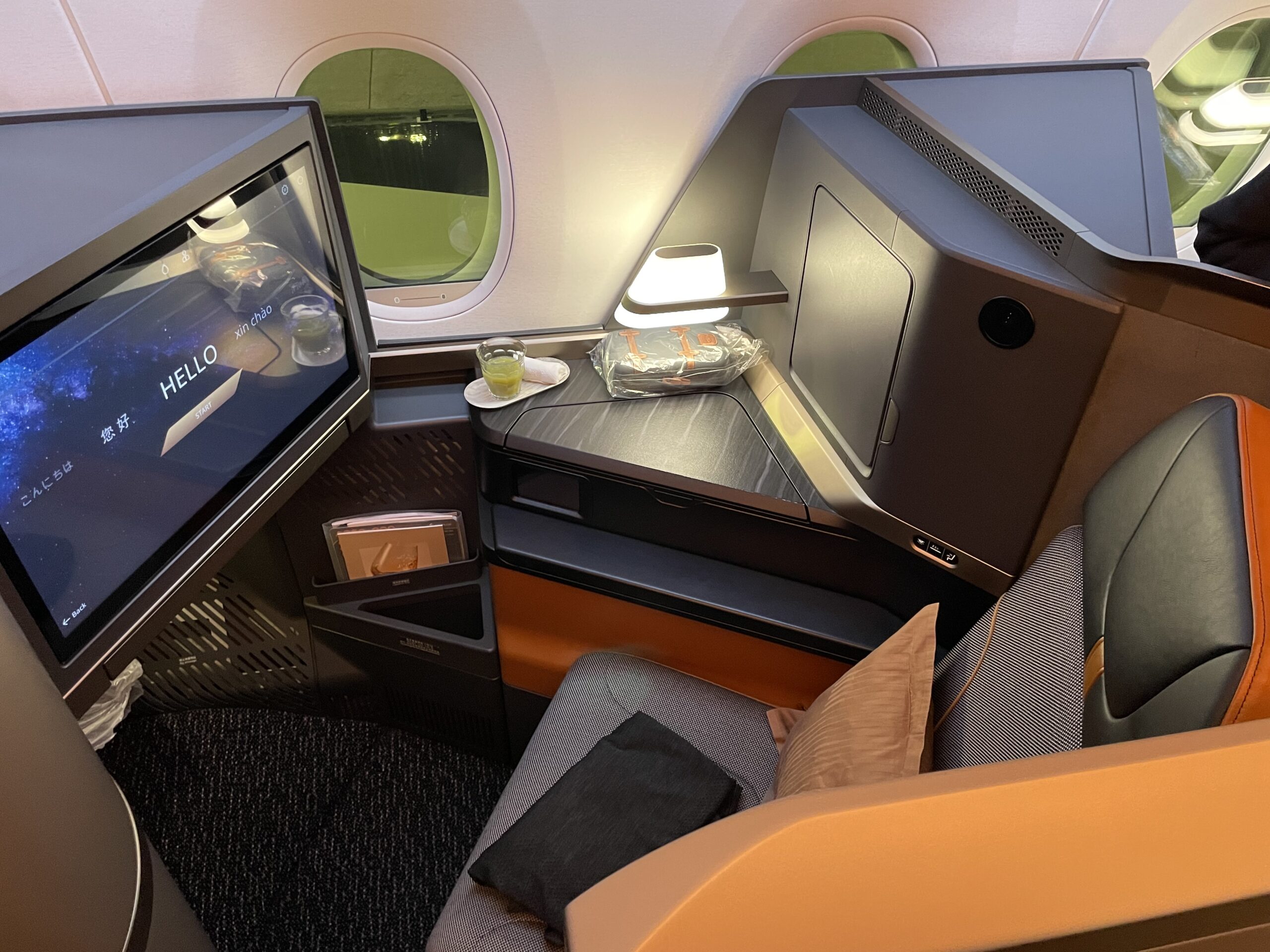 a tv and a chair in a plane