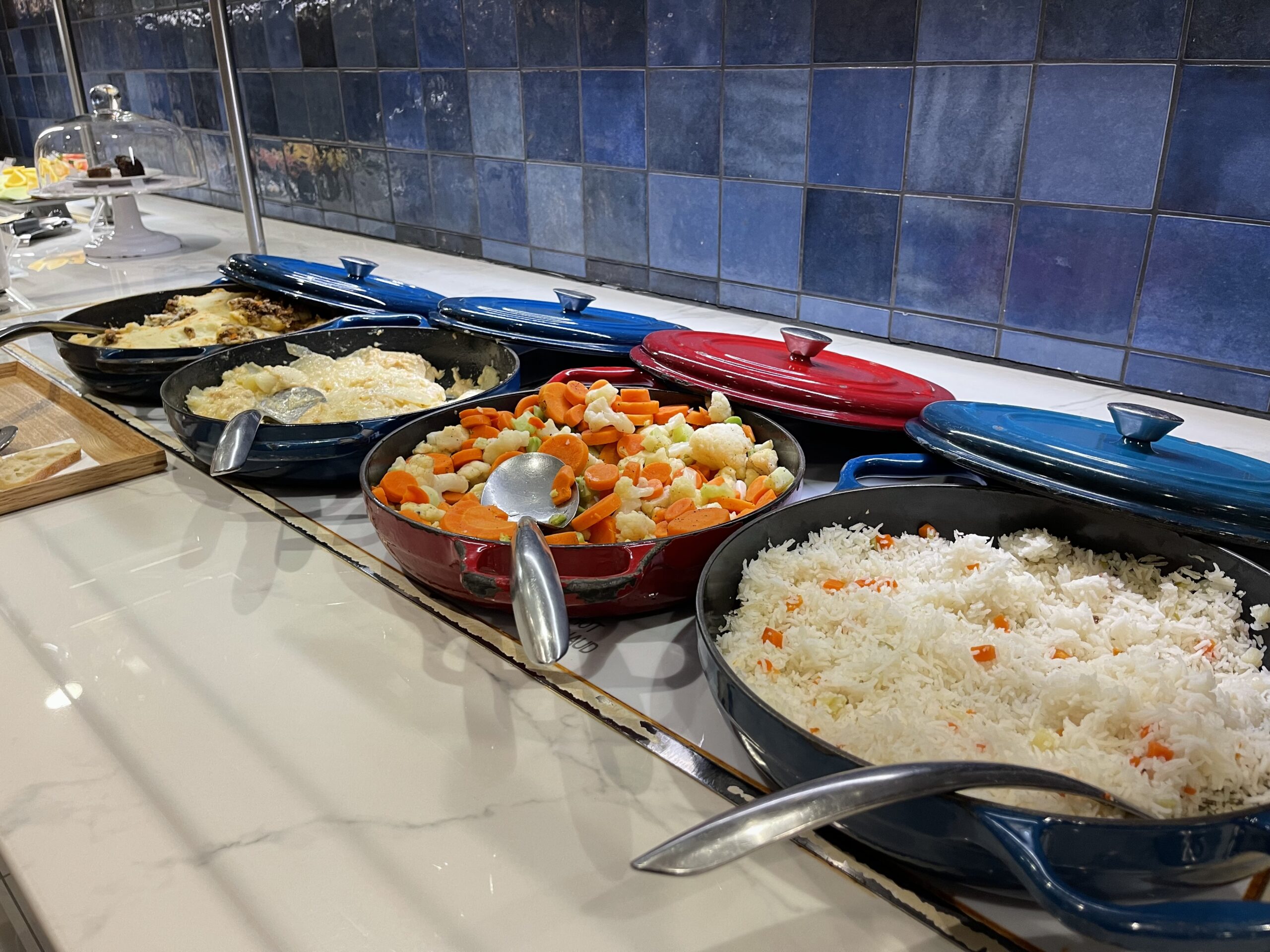 a row of bowls of food