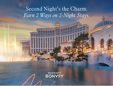 a large building with a fountain in front of it with Bellagio in the background