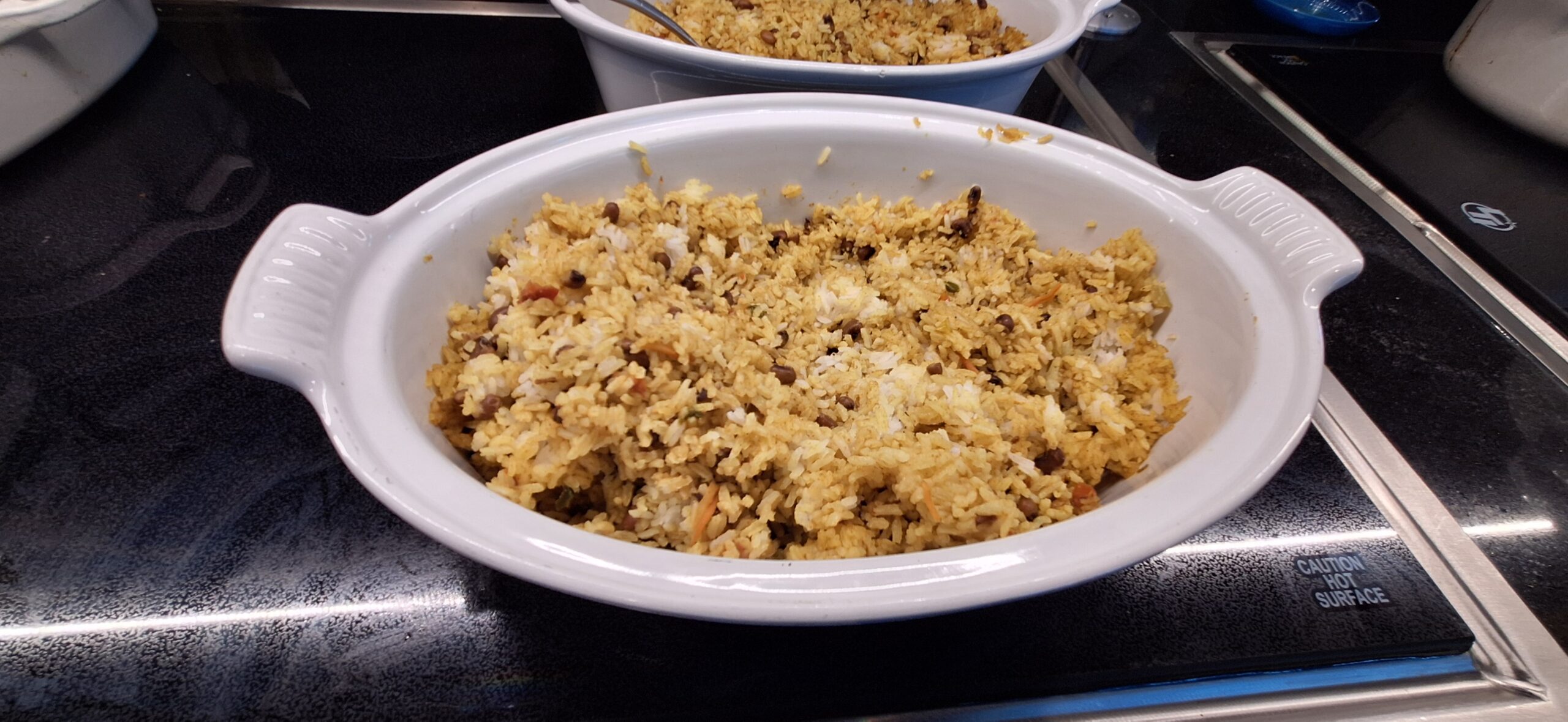 two bowls of rice on a stove