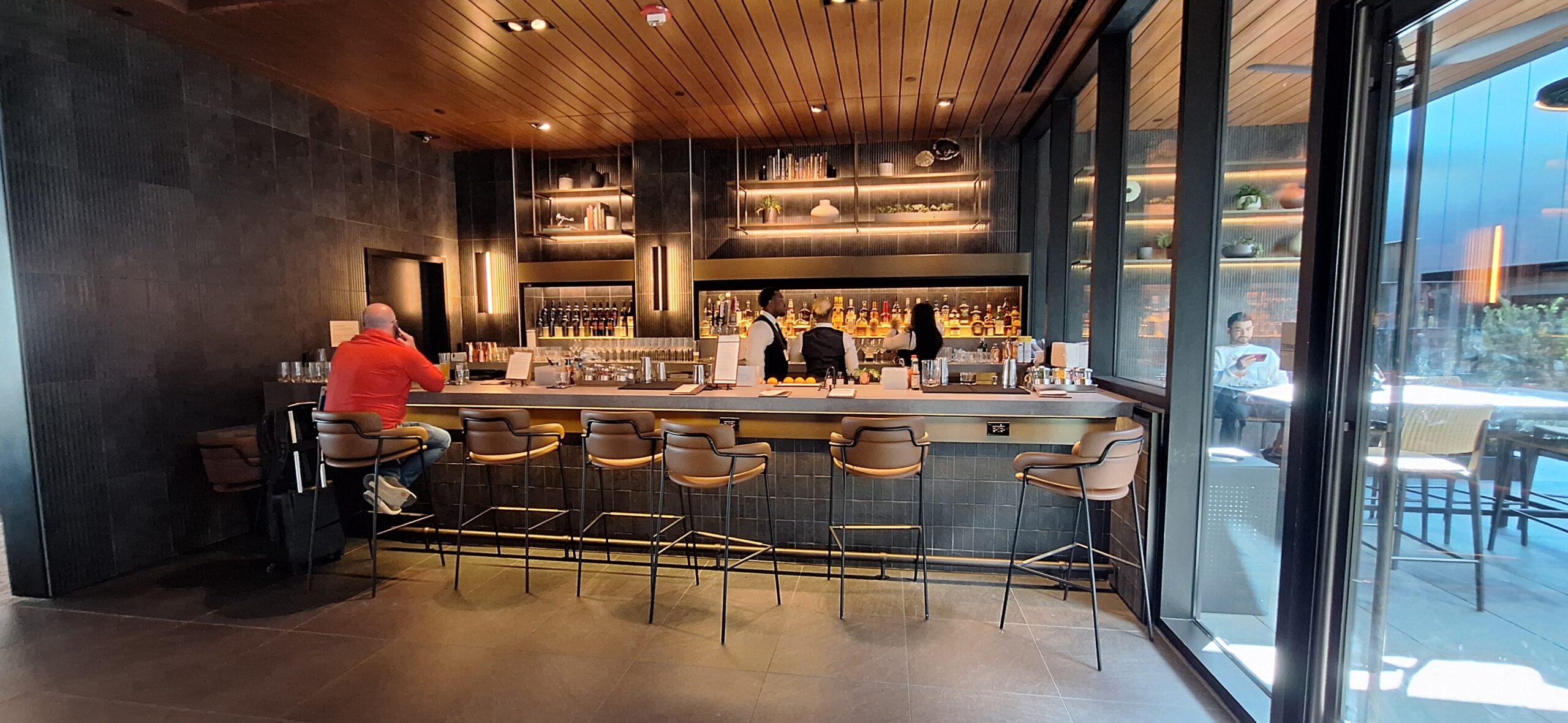 a bar with people behind the counter