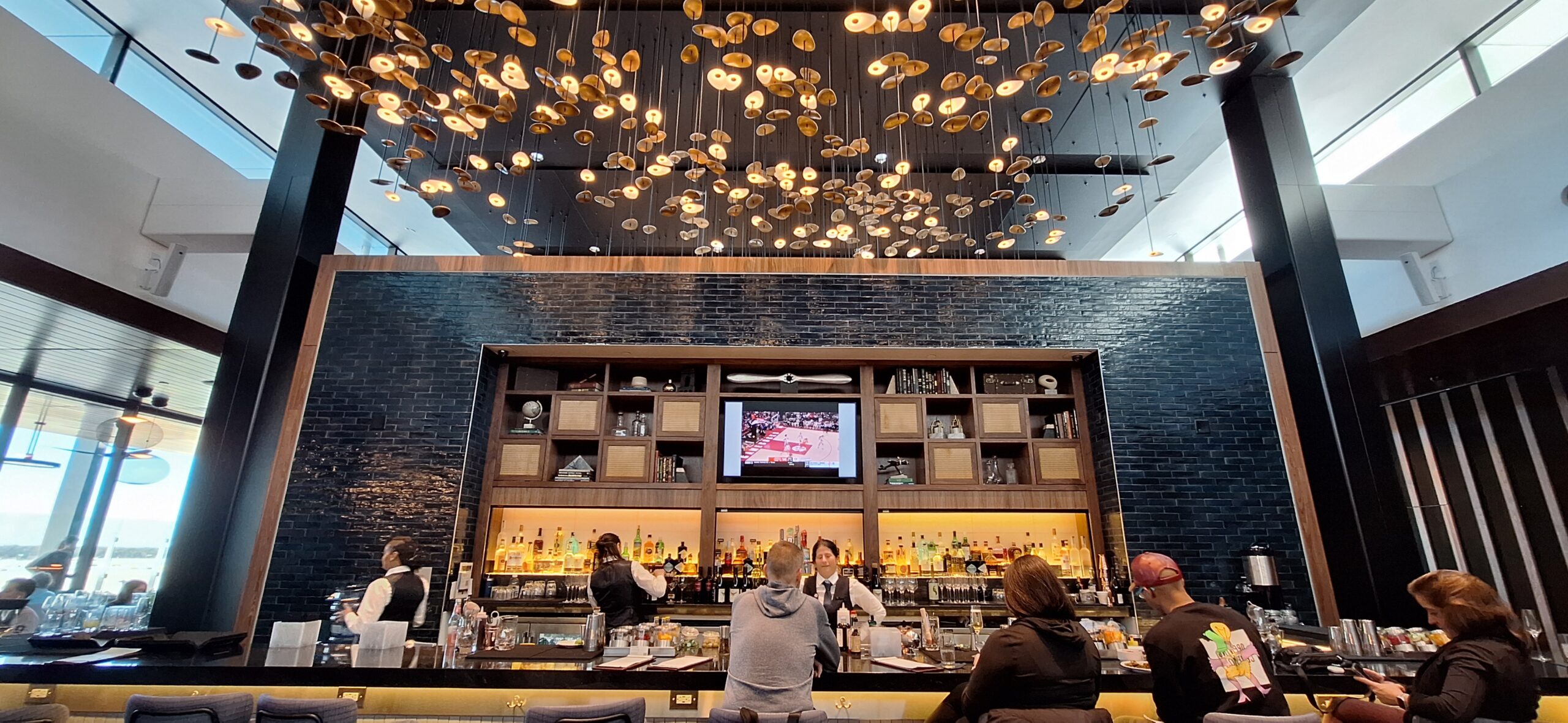 a group of people sitting at a bar