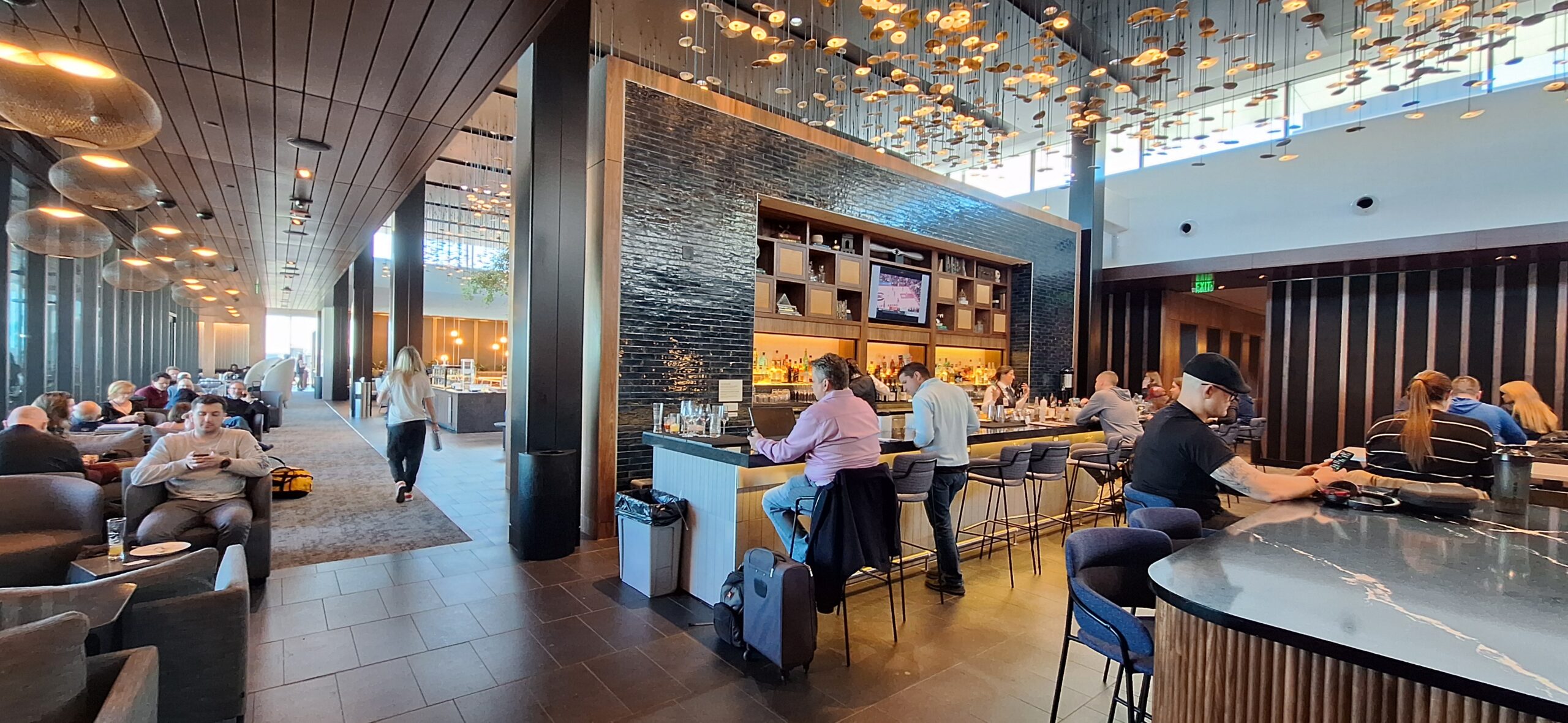 a group of people sitting at a bar