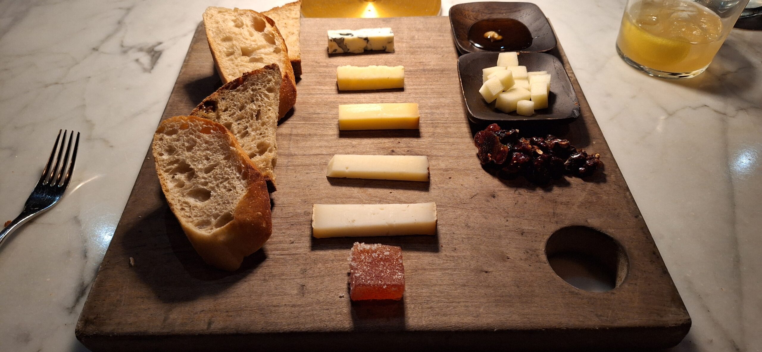 a board with cheese and bread