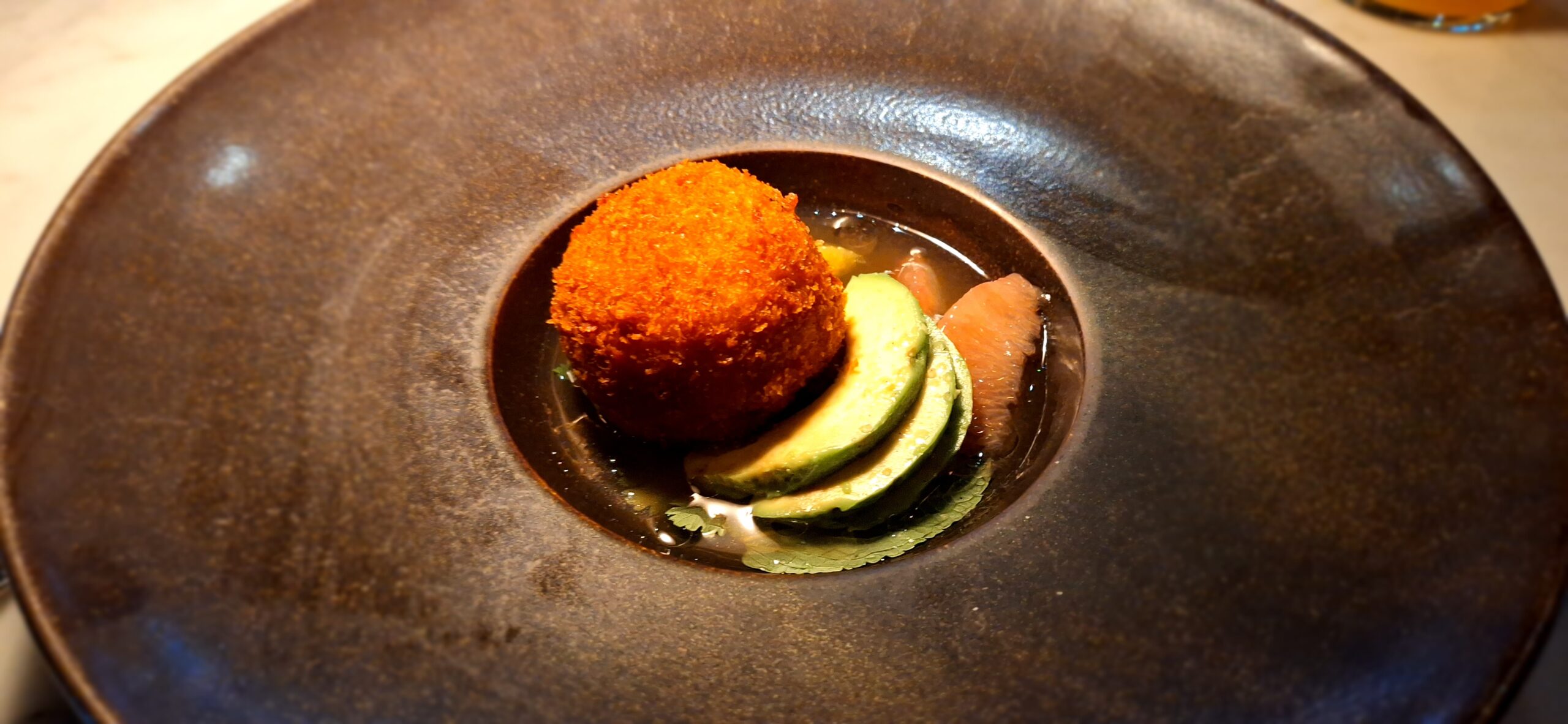 a plate of food with a round object on it