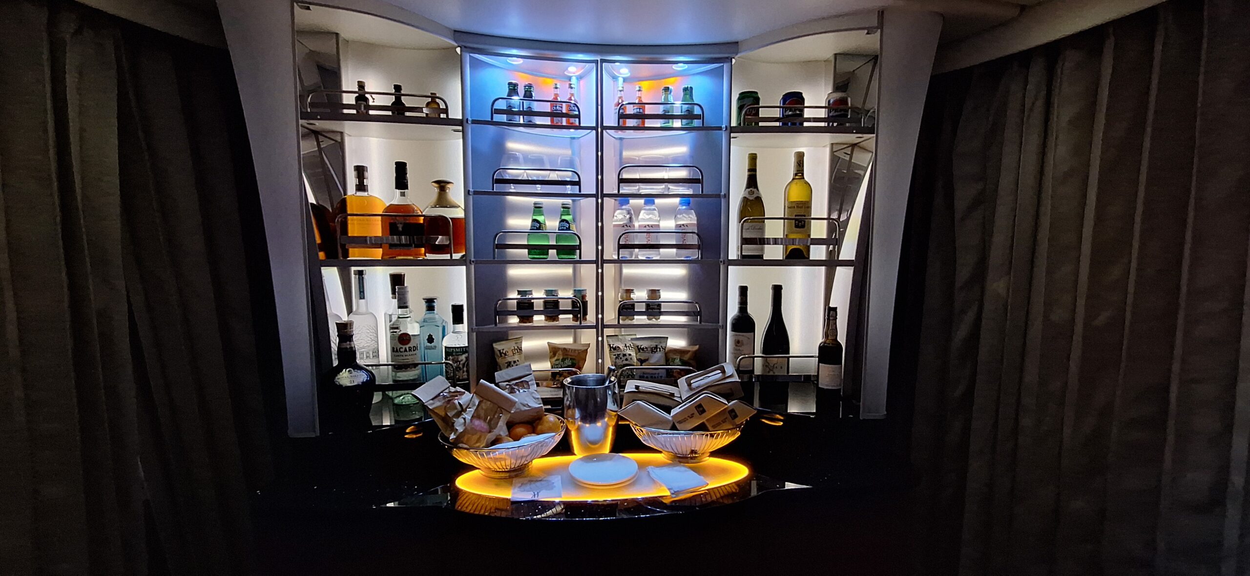 a bar with shelves of liquor and bottles