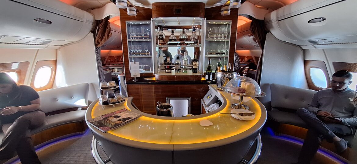 a bar with a counter and glasses on it