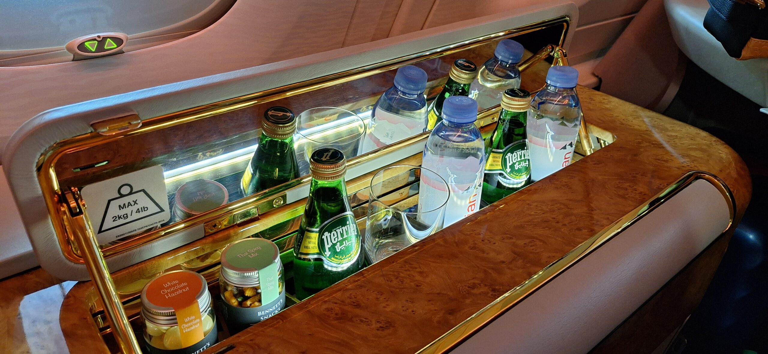 a row of bottles and glasses on a bar