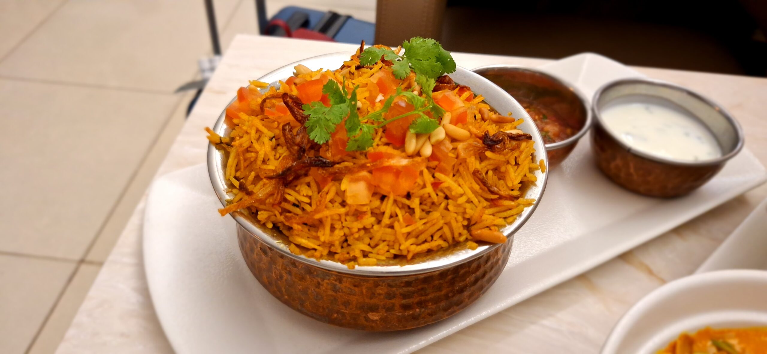 a bowl of rice with vegetables and spices