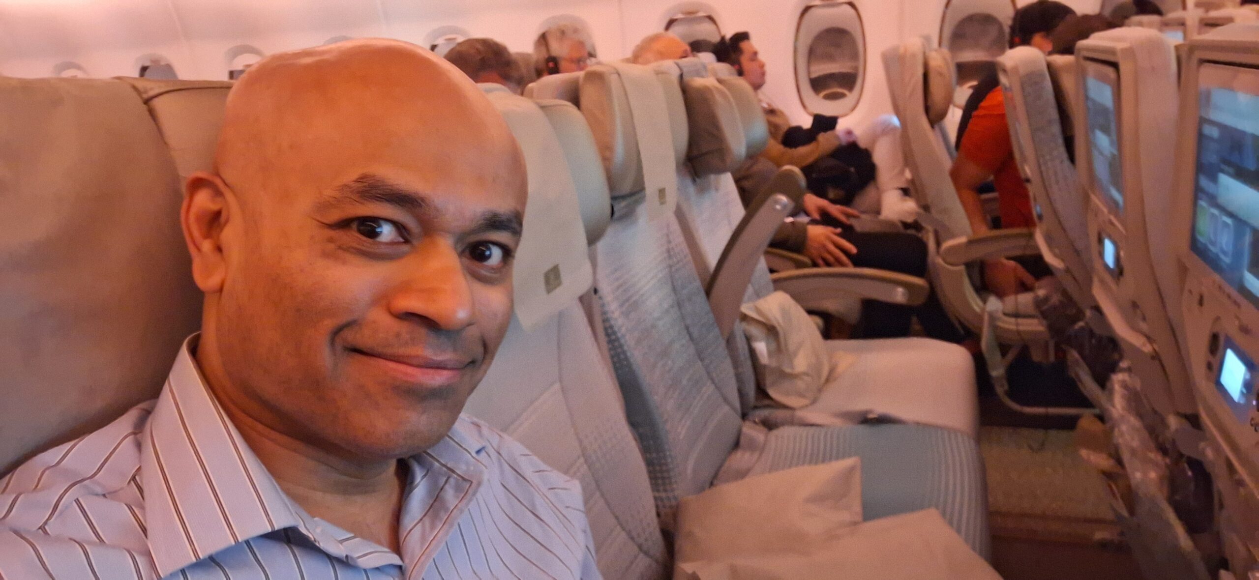 a man taking a selfie in an airplane