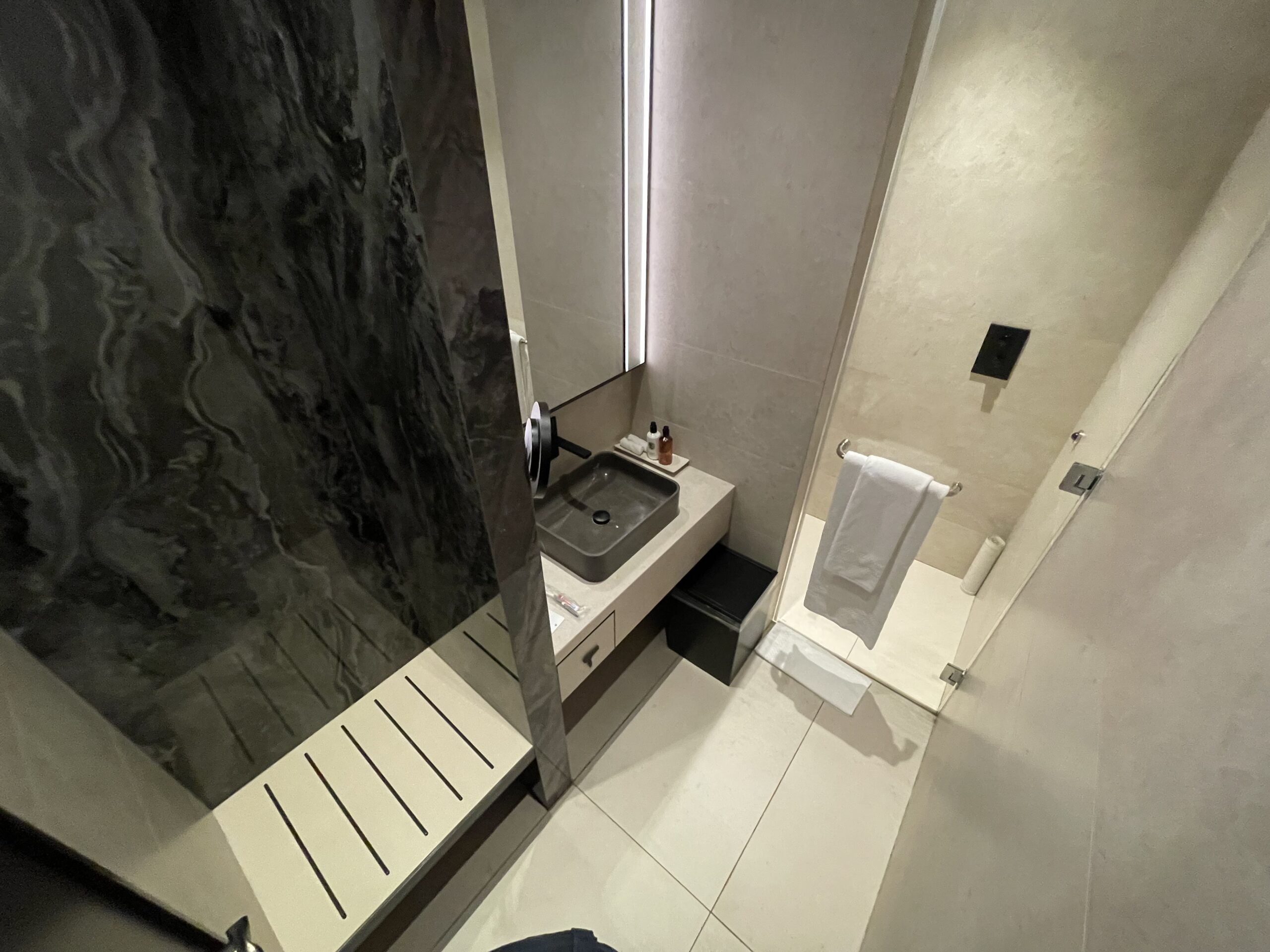 a bathroom with a sink and shower