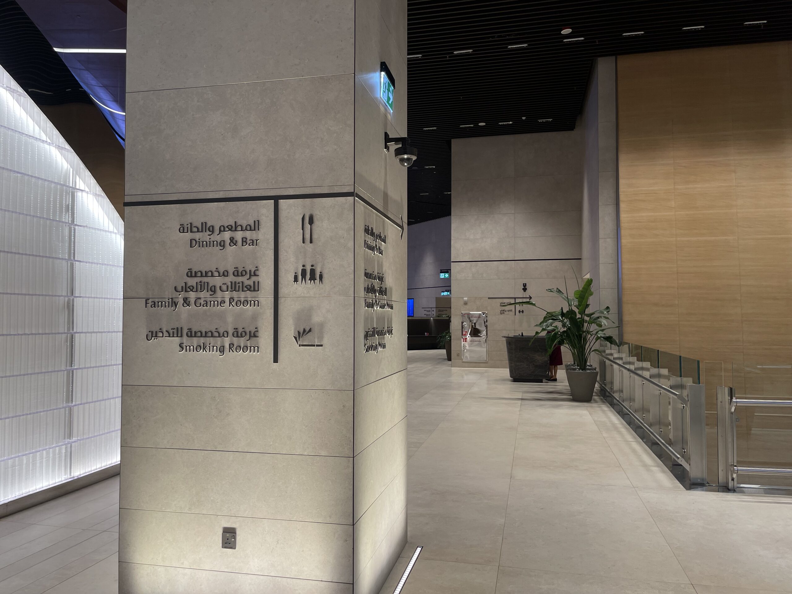 a large stone pillar with signs on it