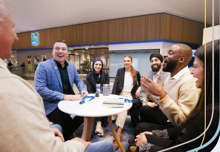 a group of people sitting around a round table