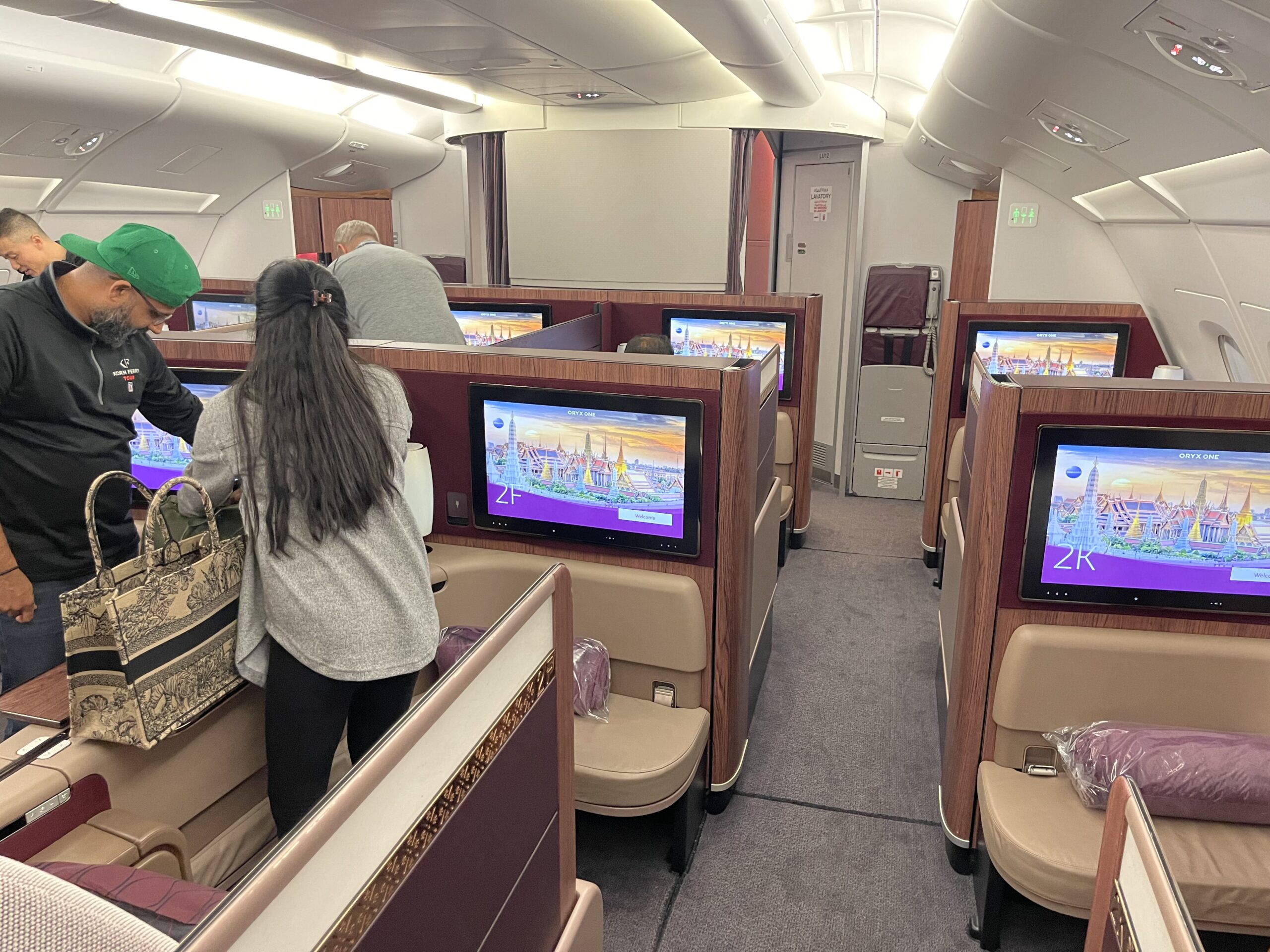 people in an airplane with a few monitors