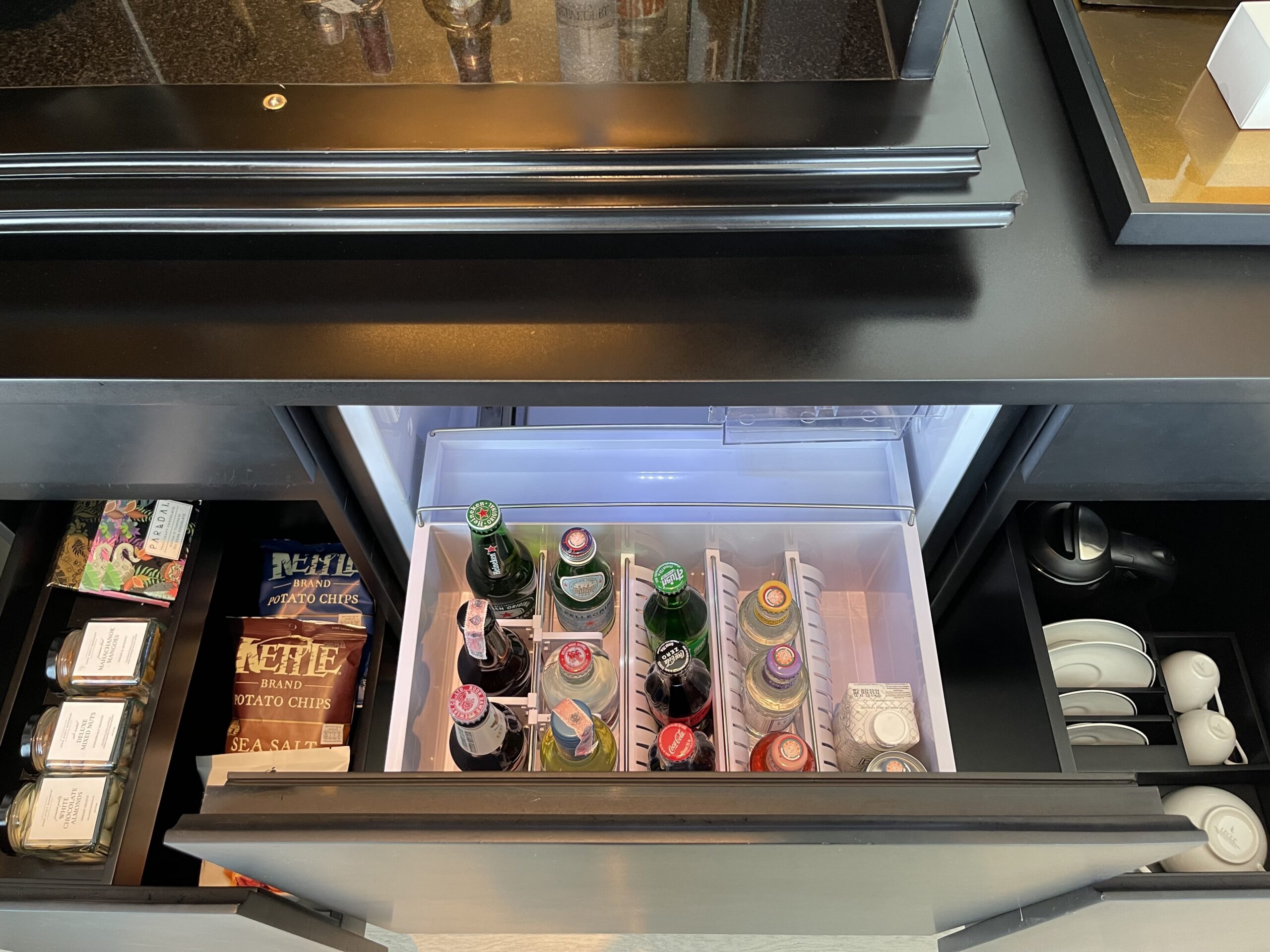 a open refrigerator with bottles of beer inside