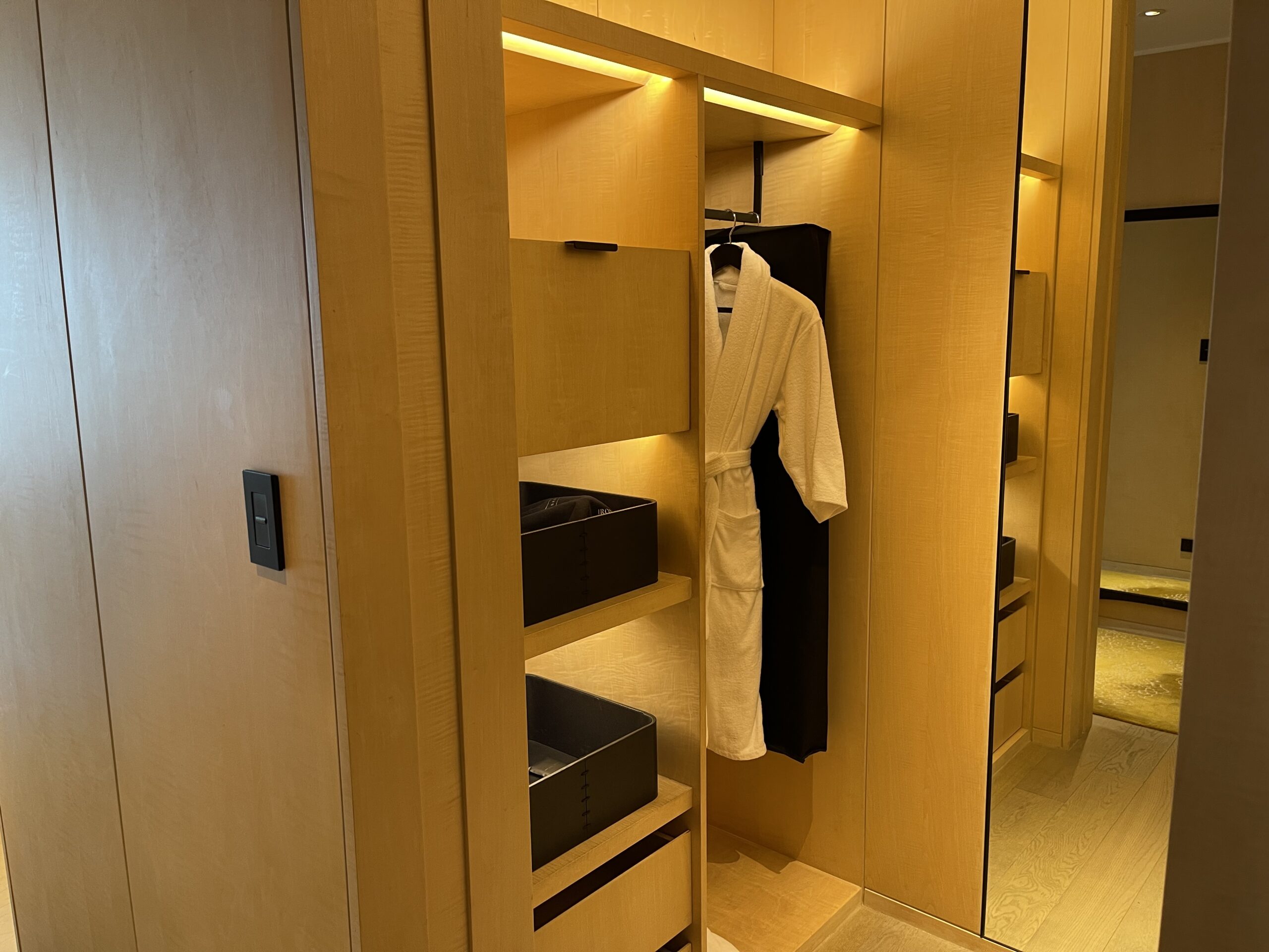 a closet with a robe in it