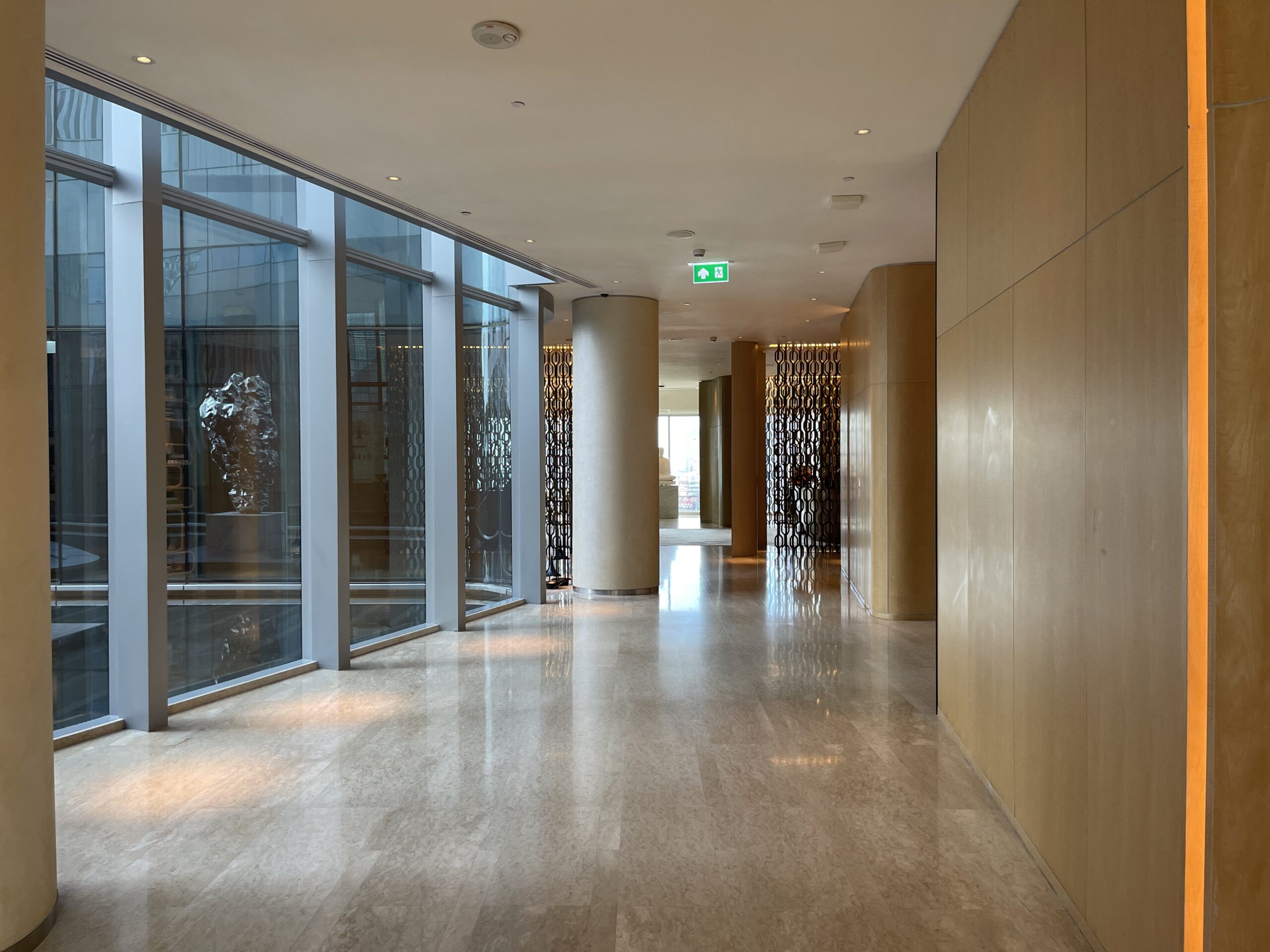 a hallway with large windows