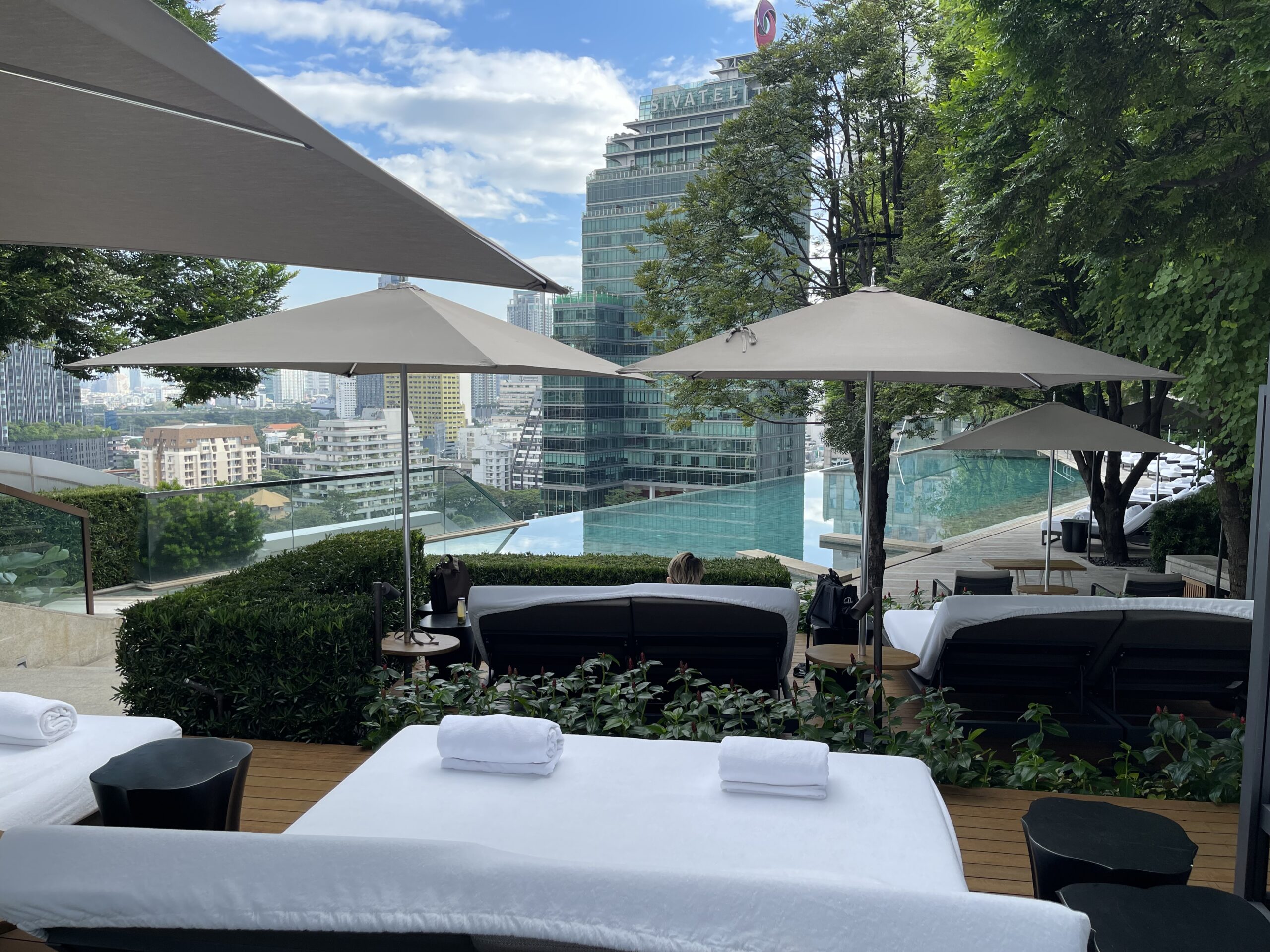 a pool with a view of a city and a pool