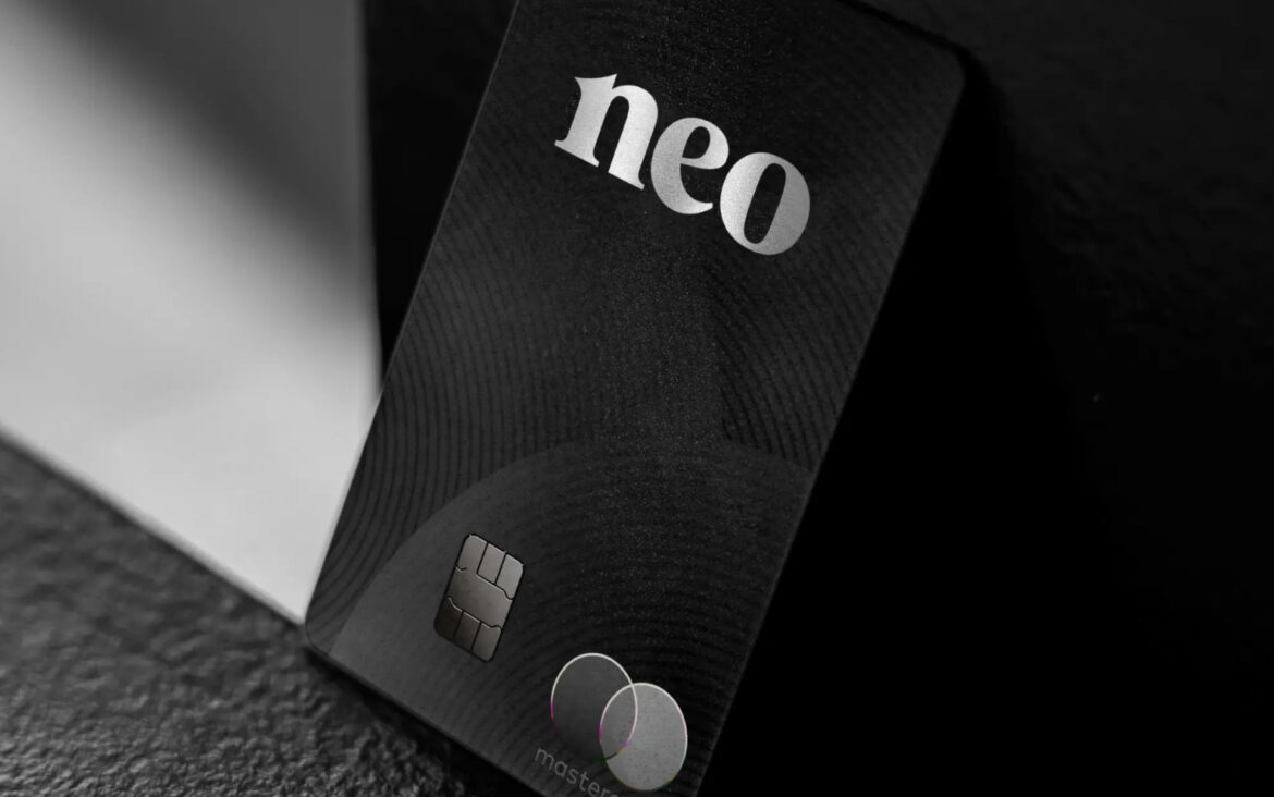 a black credit card with silver text