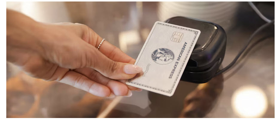 a hand holding a credit card