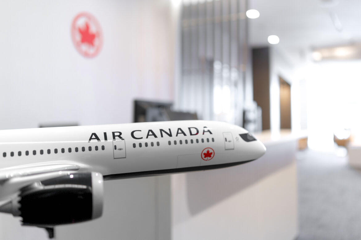 Air Canada Maple-Leaf-Lounge_LAX a model airplane in a room