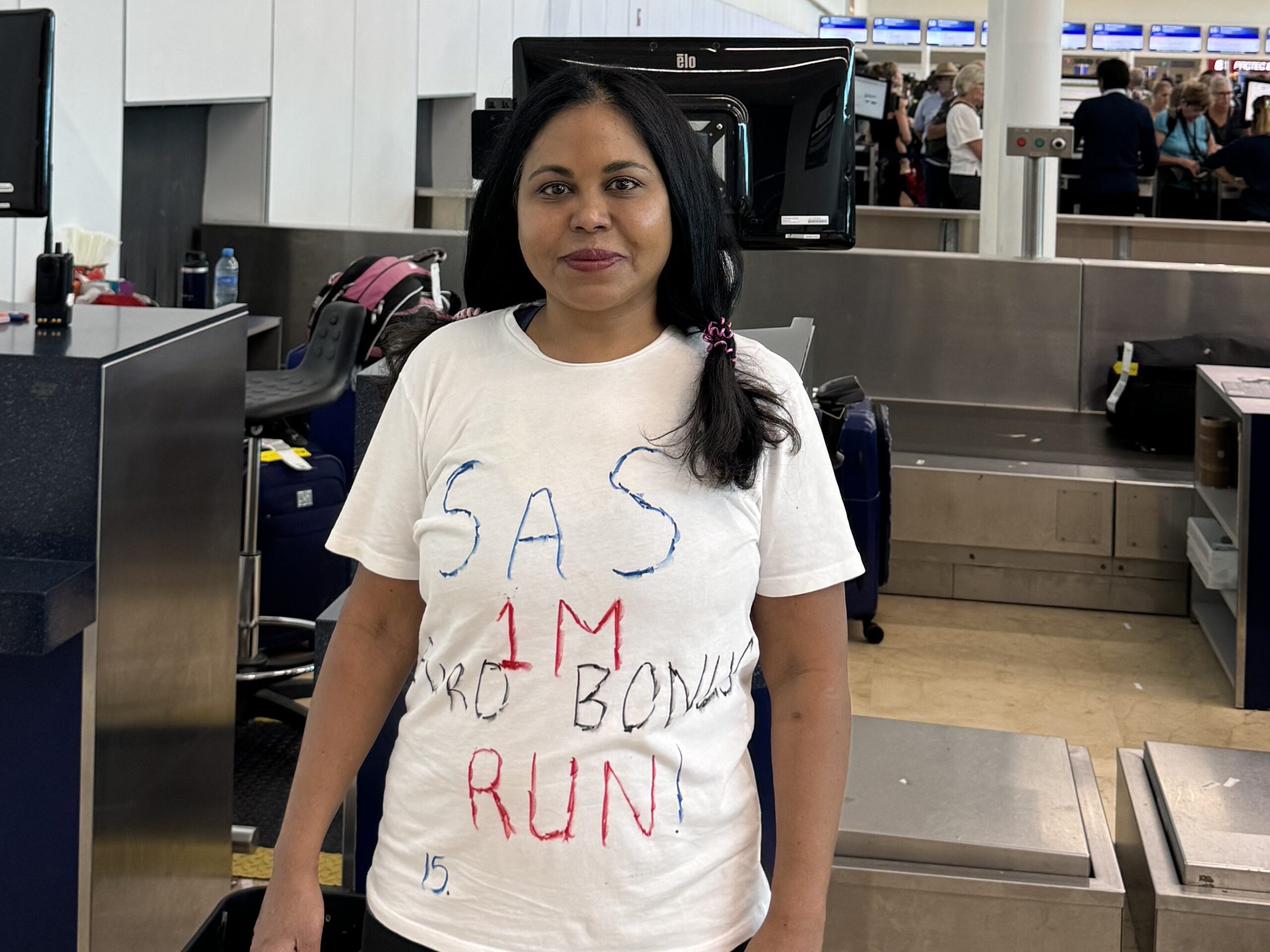 a woman standing in an airport