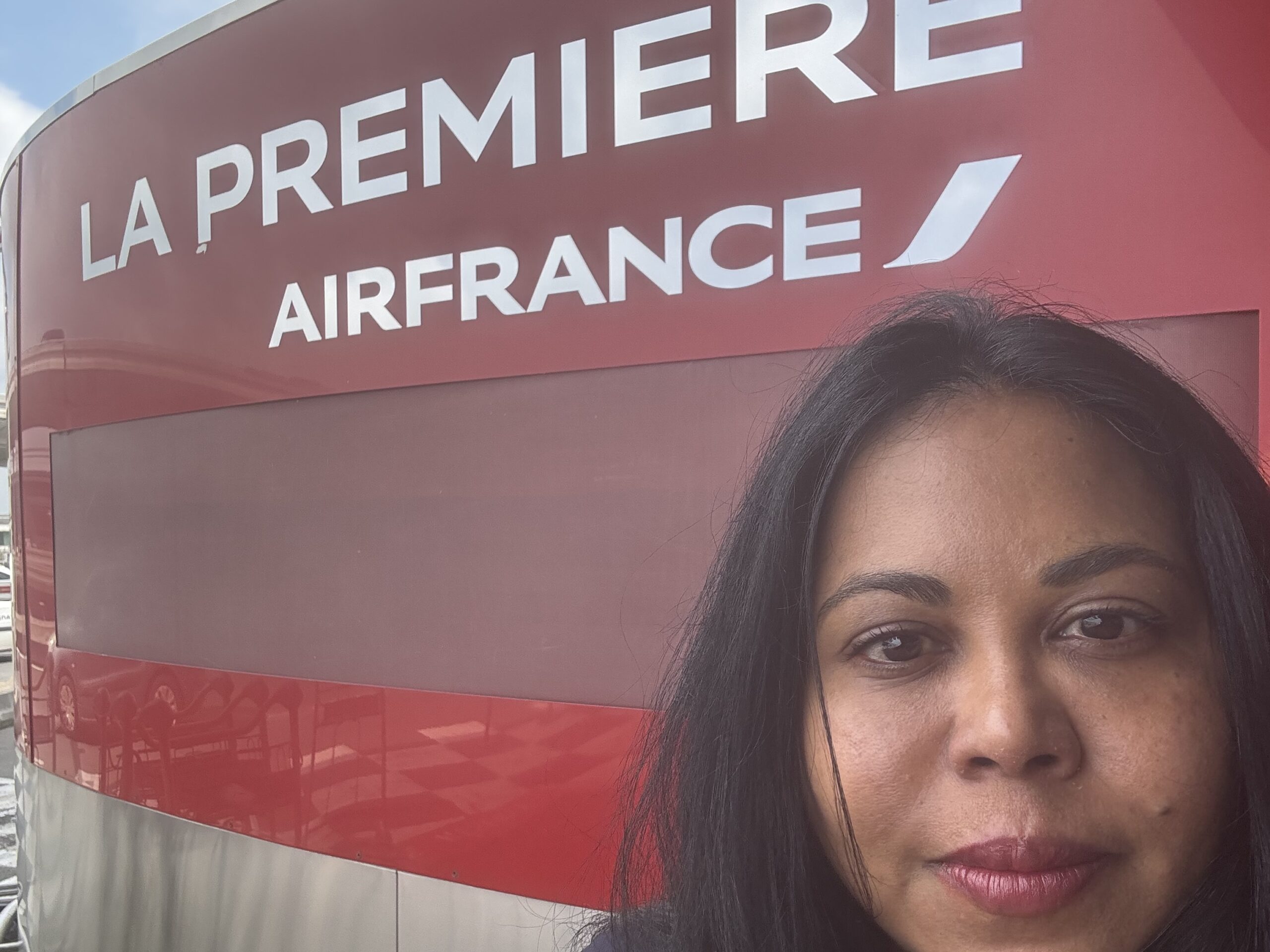 a woman standing in front of a sign