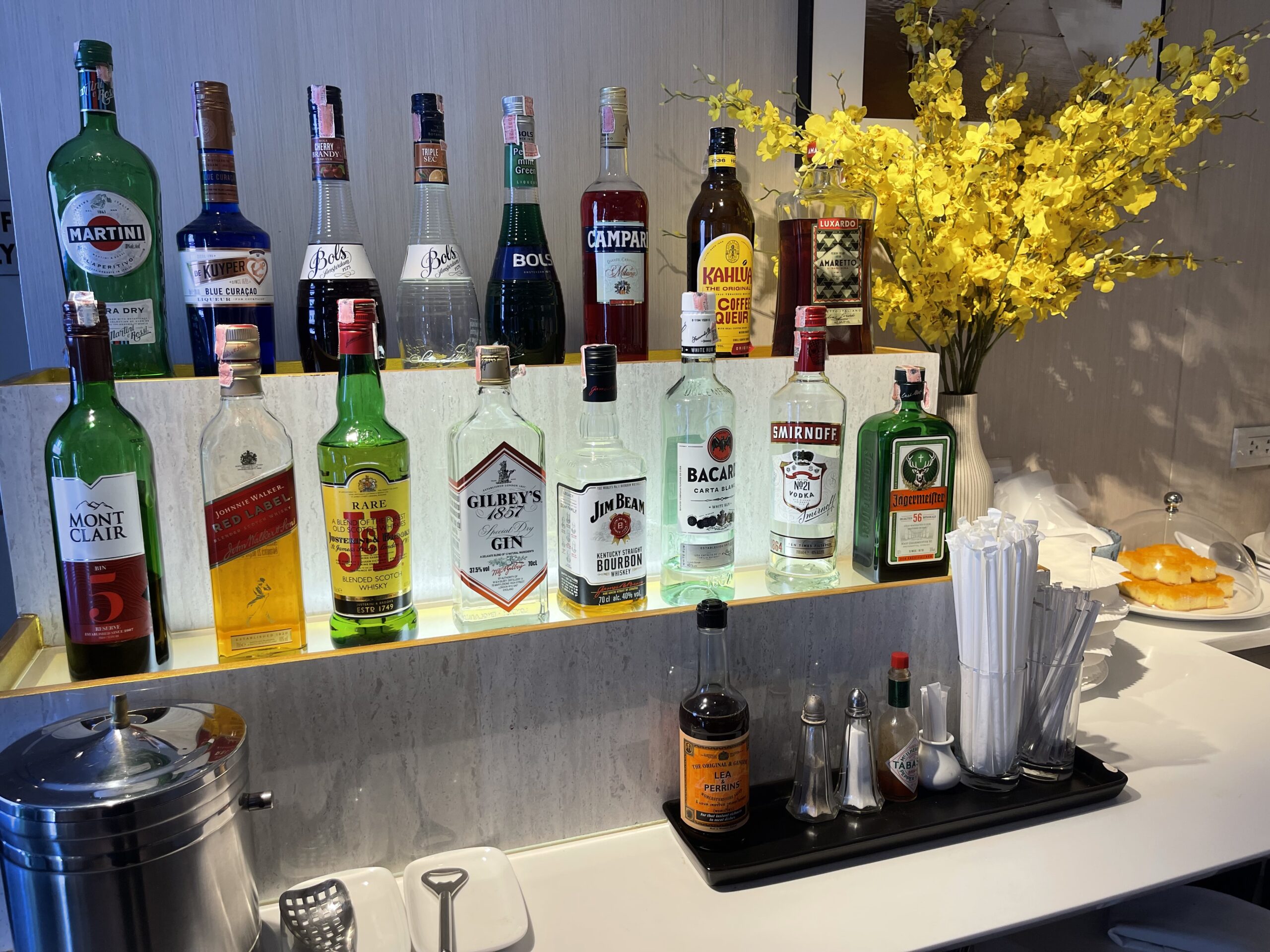 a shelf with bottles of alcohol