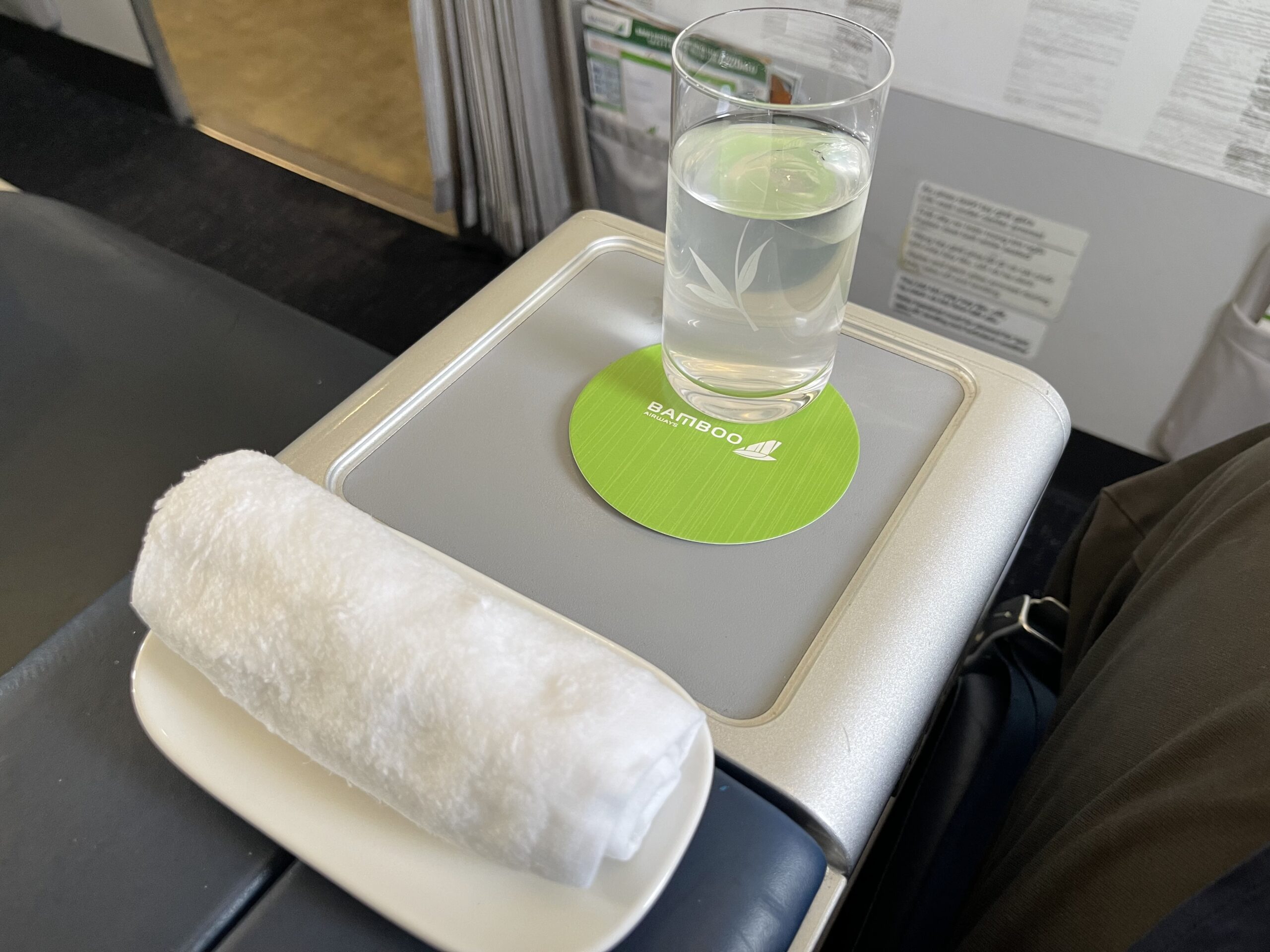 a glass of water on a plate