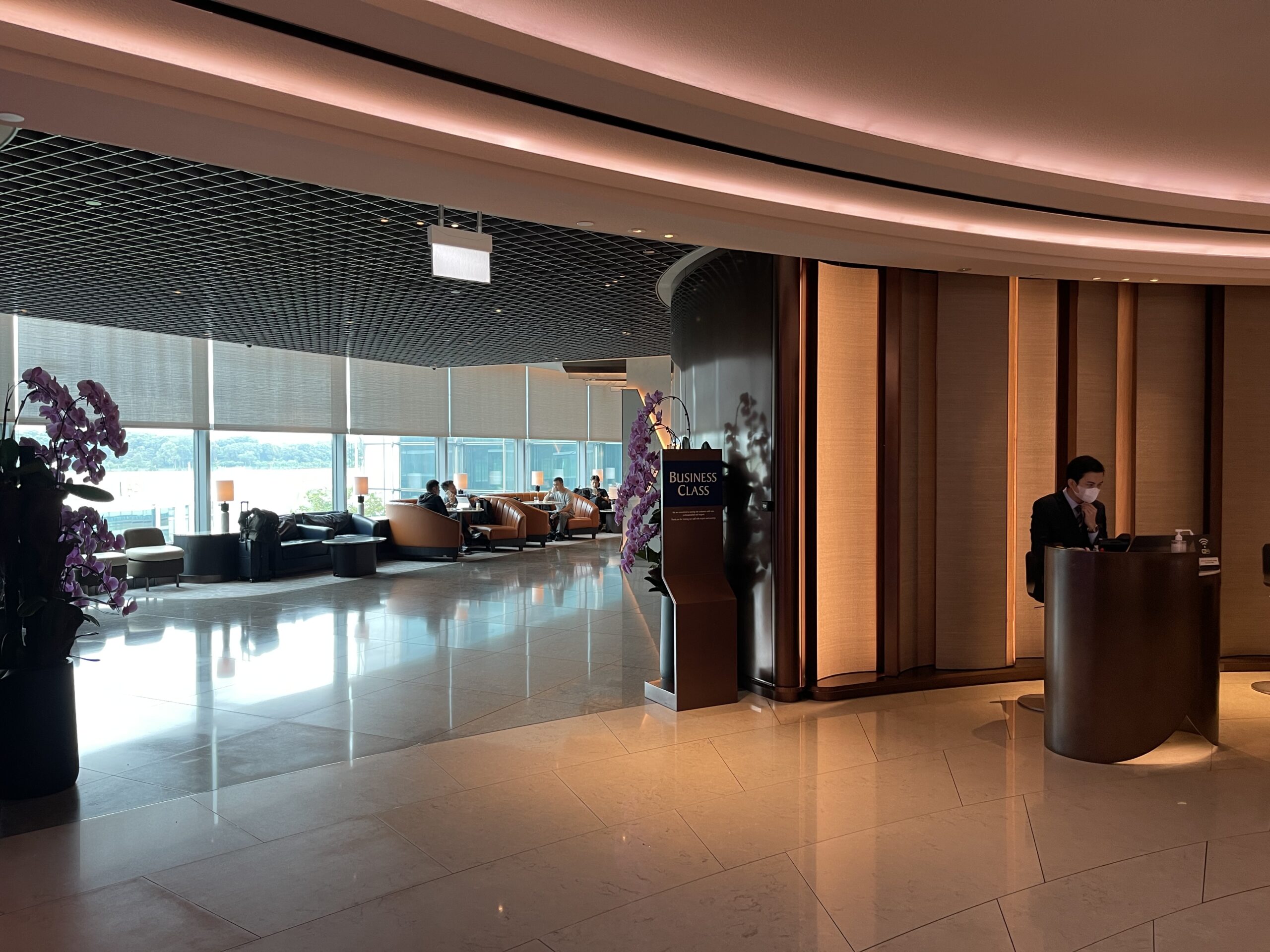 a man standing at a podium in a lobby