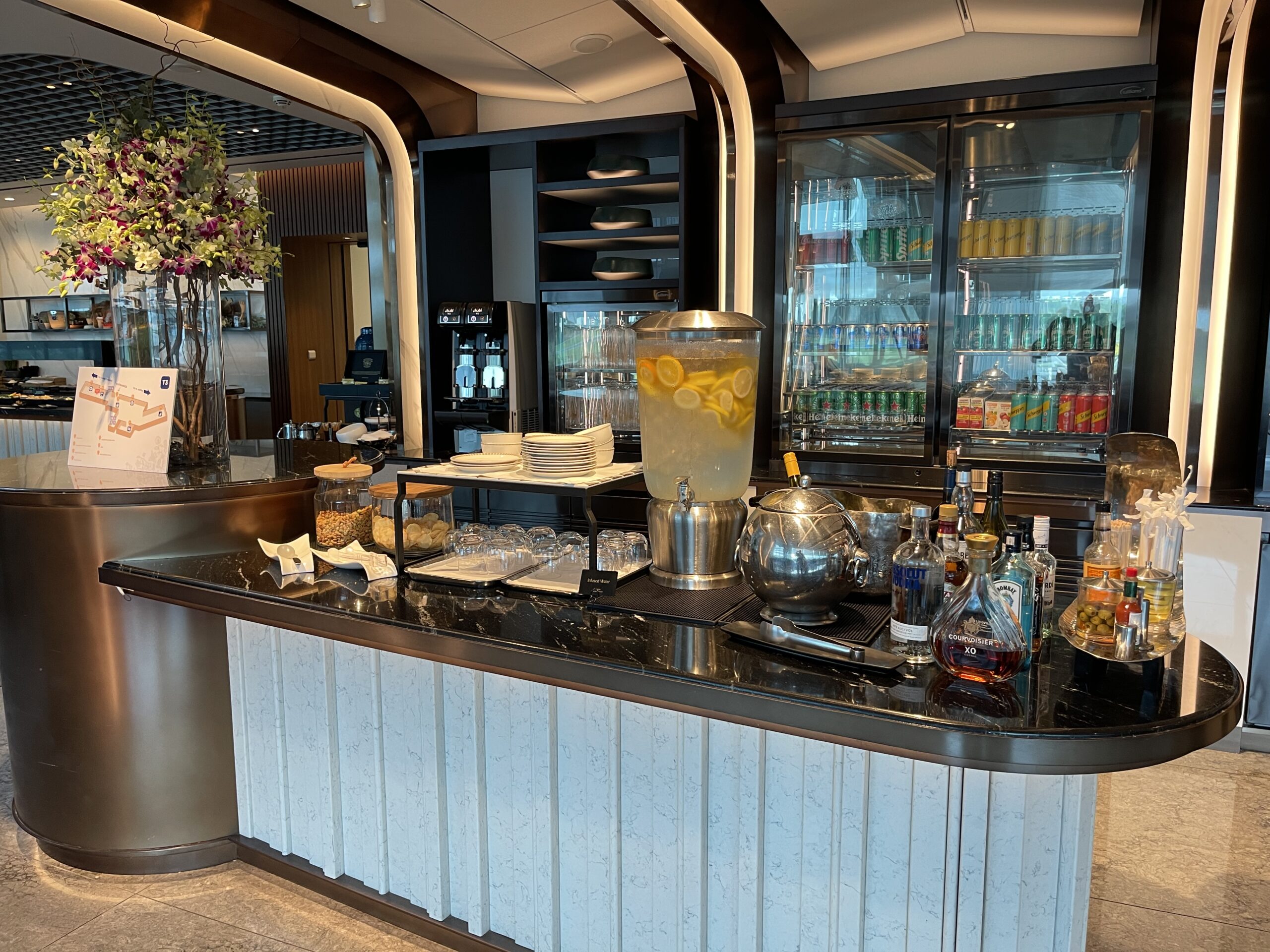 a counter with drinks and beverages on it