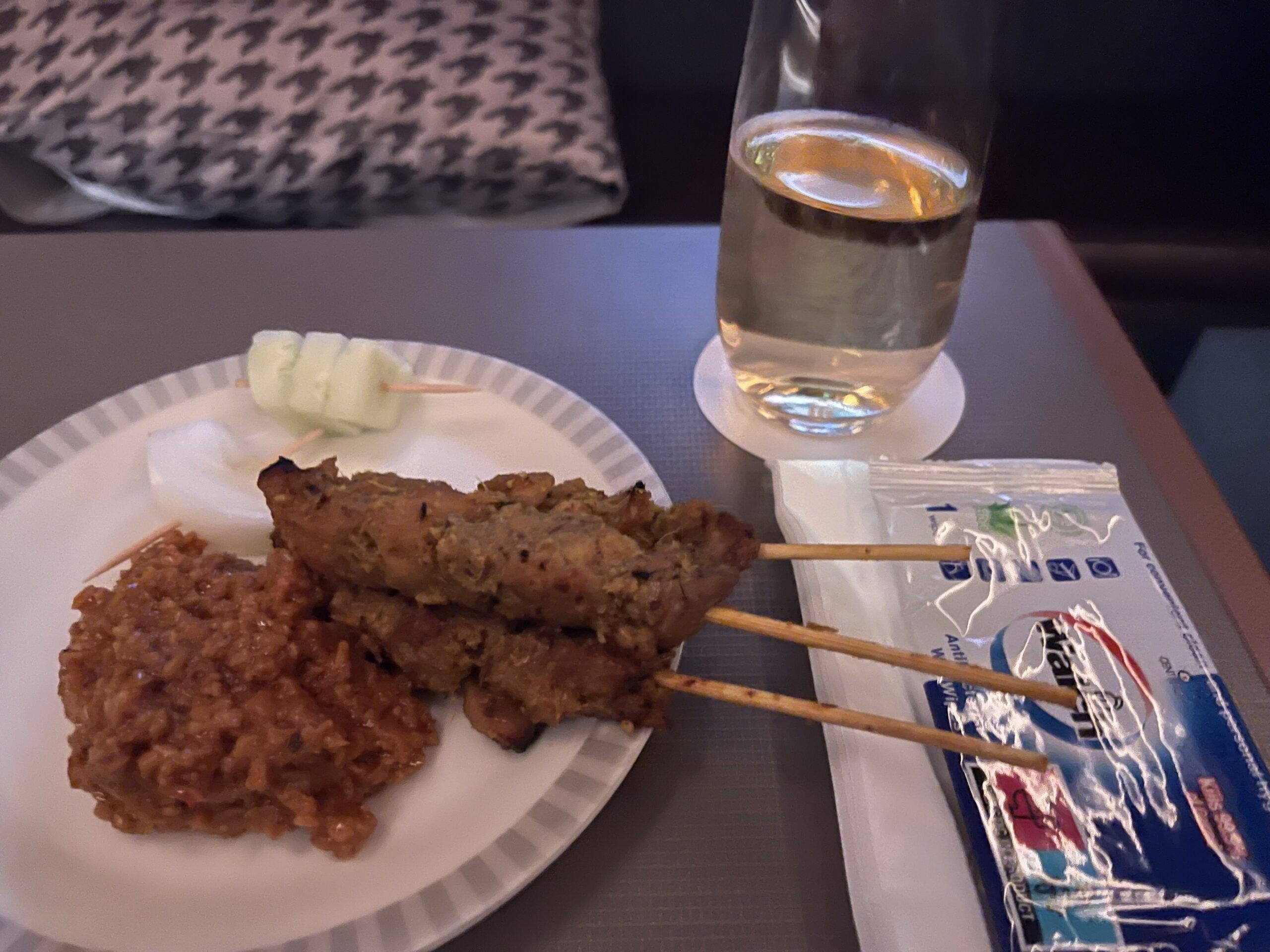 a plate of food and a glass of water