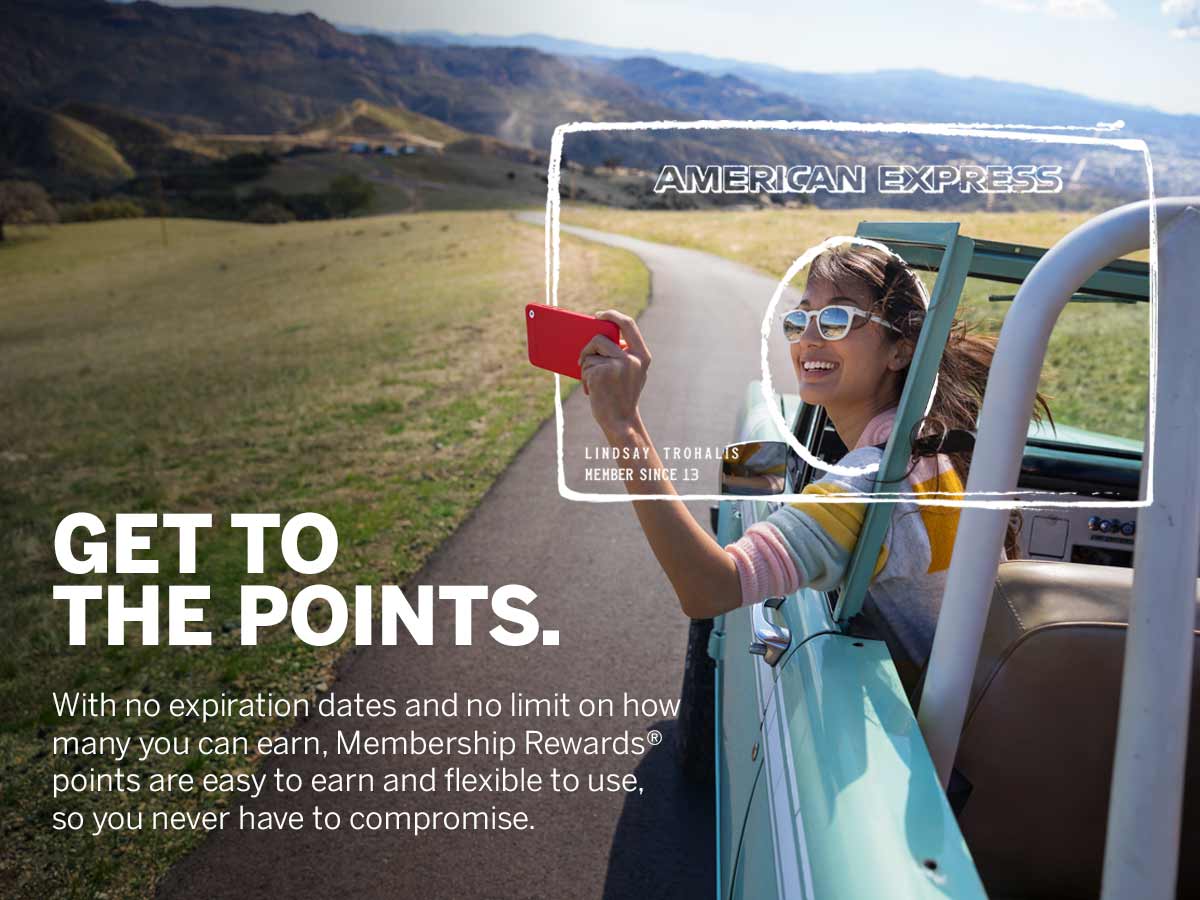 a woman in a convertible taking a selfie