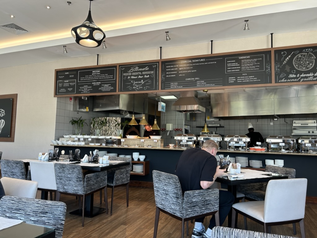 a man sitting at a table in a restaurant