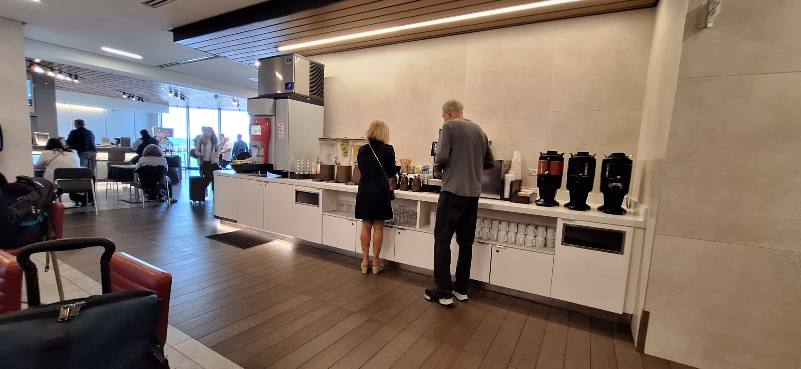 a man and woman standing at a counter