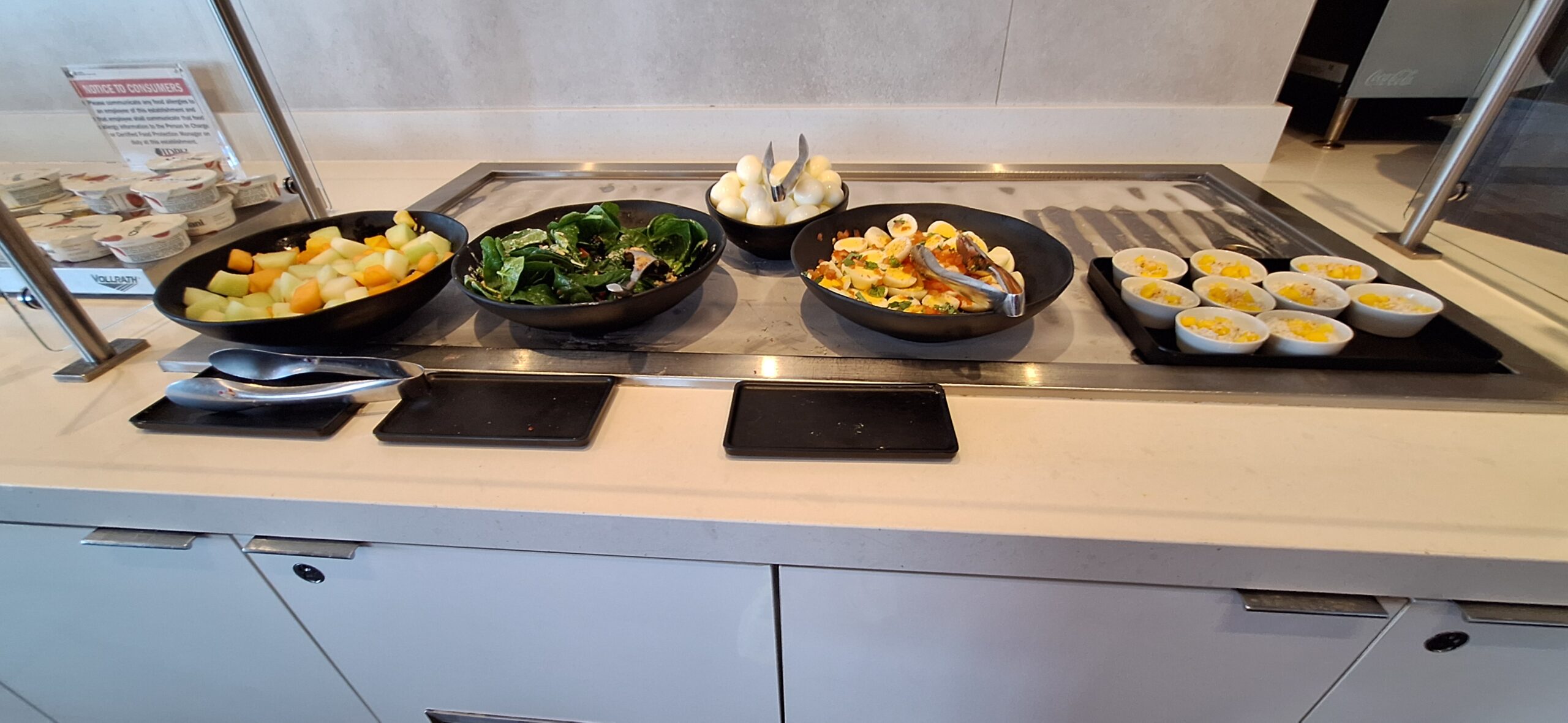 a group of bowls of food on a counter